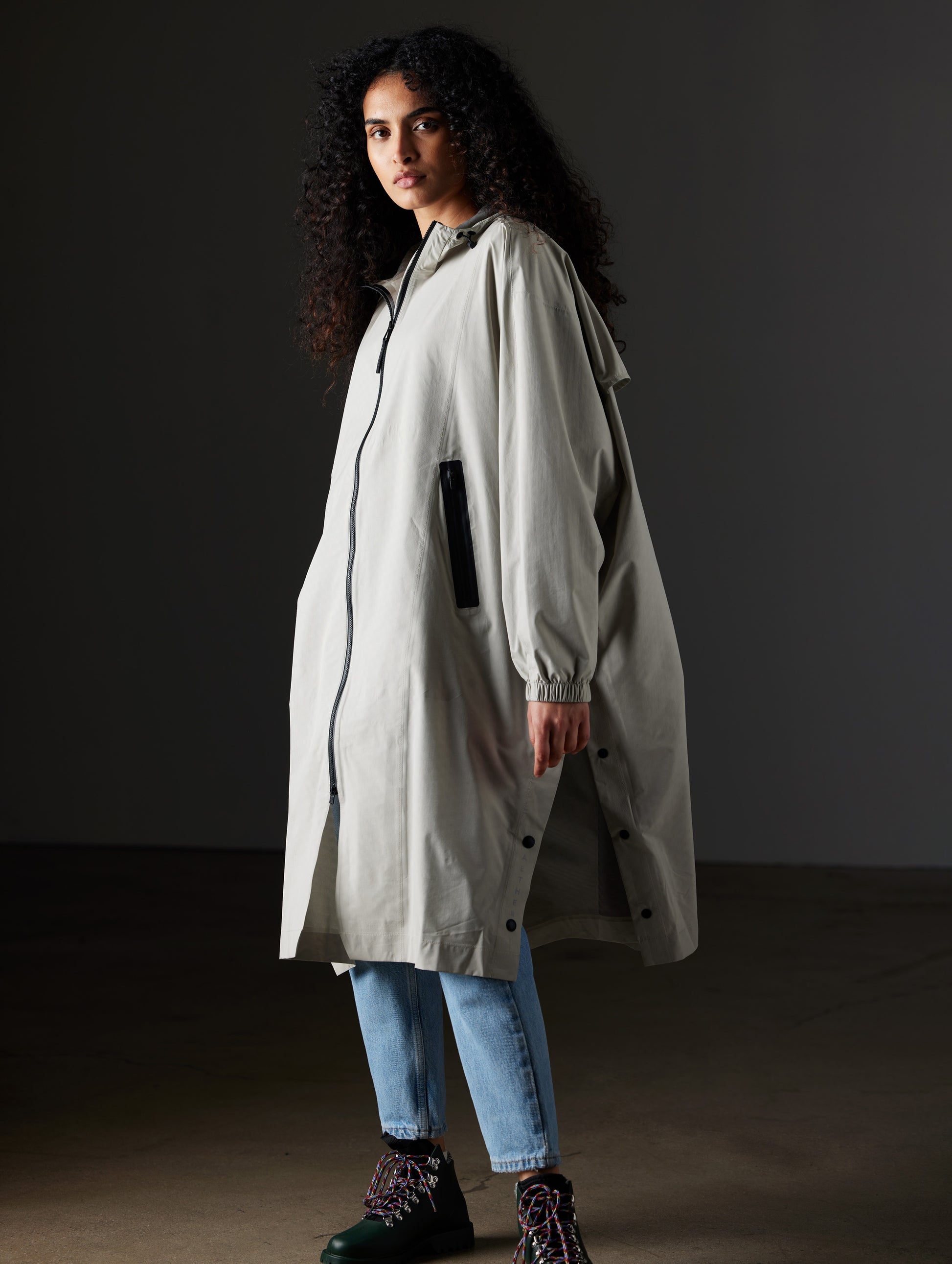 Woman wearing grey poncho from AETHER Apparel