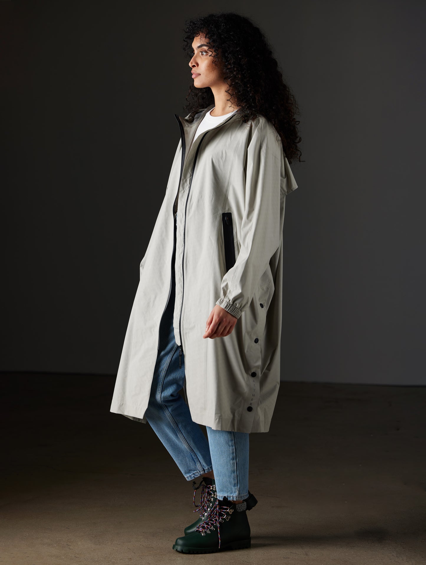 Woman wearing grey poncho from AETHER Apparel