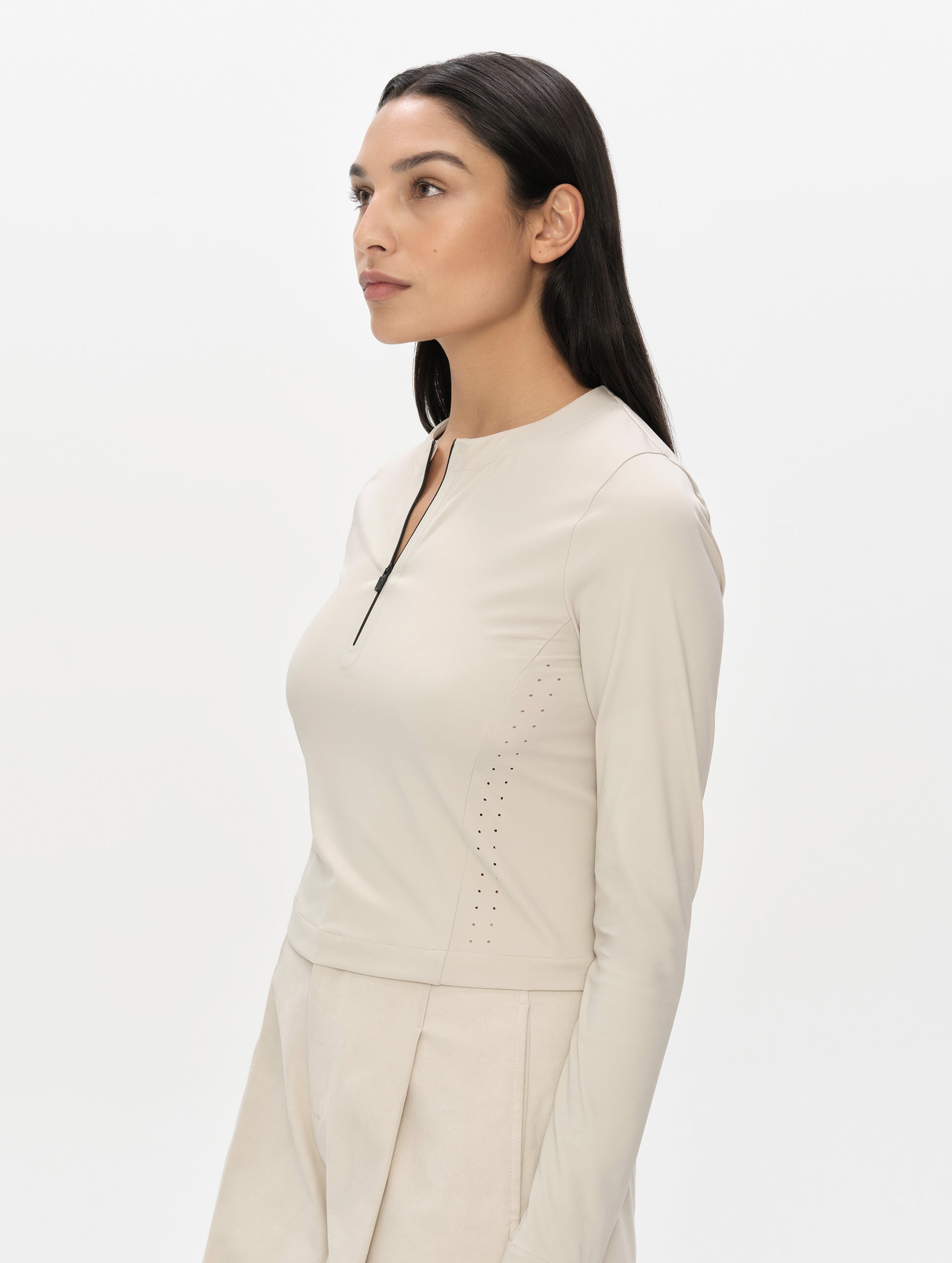 Front, 3/4, upper-body view of woman wearing the Kora Sunproof Shirt in Bone from AETHER Apparel.