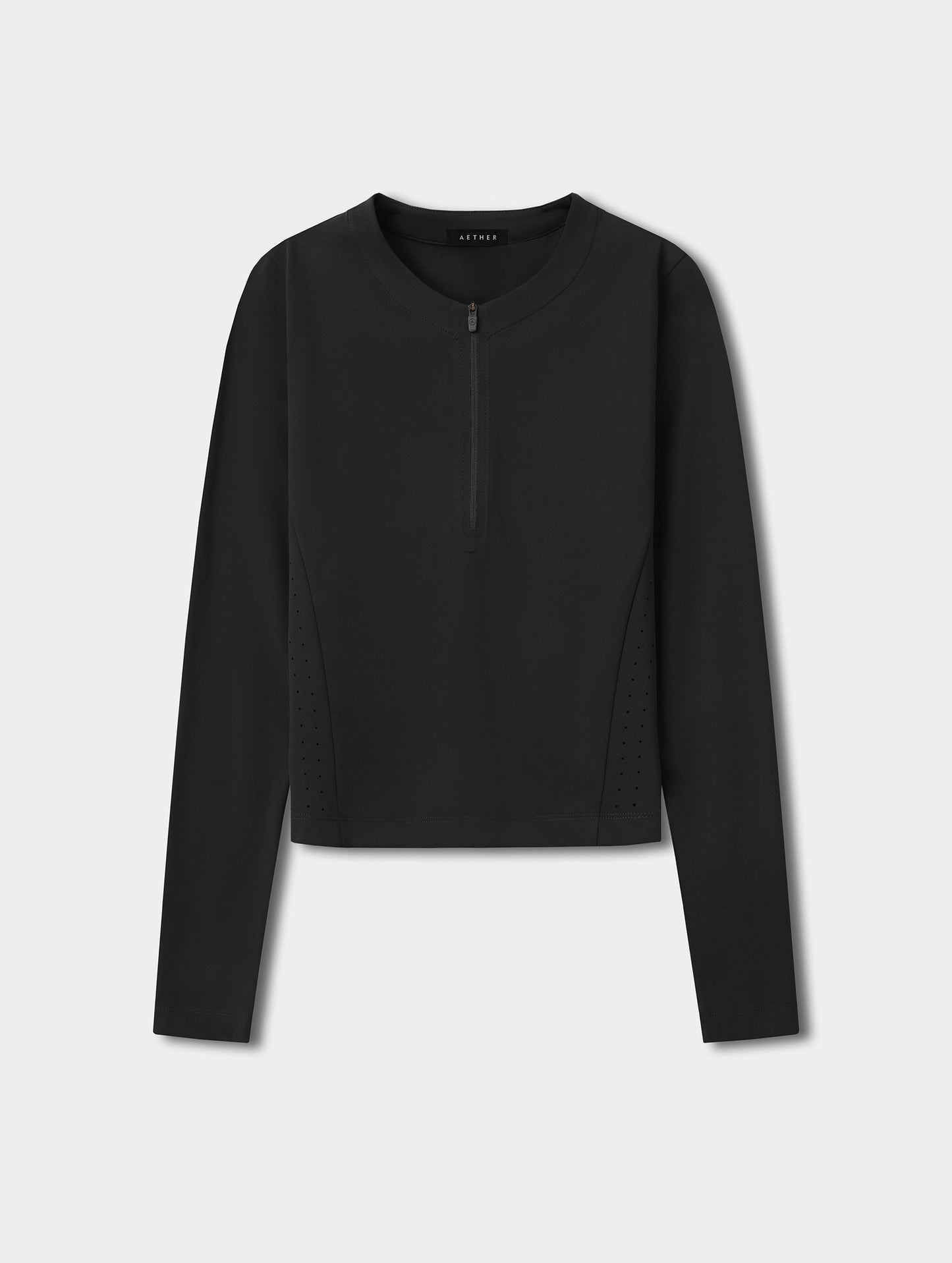 Flat lay view of the Kora Sunproof Shirt in Onyx Black from AETHER.