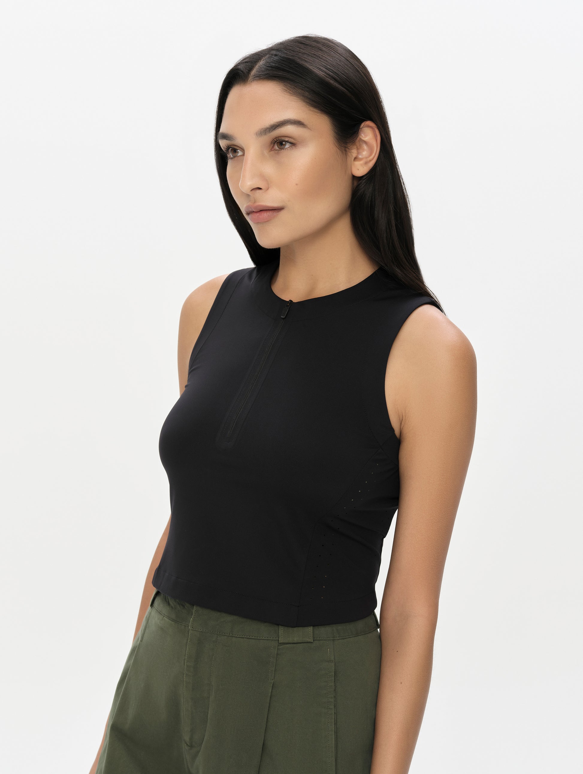 Front, 3/4, upper-body view of woman wearing the Kora Sunproof Tank Top in Onyx Black from AETHER Apparel.