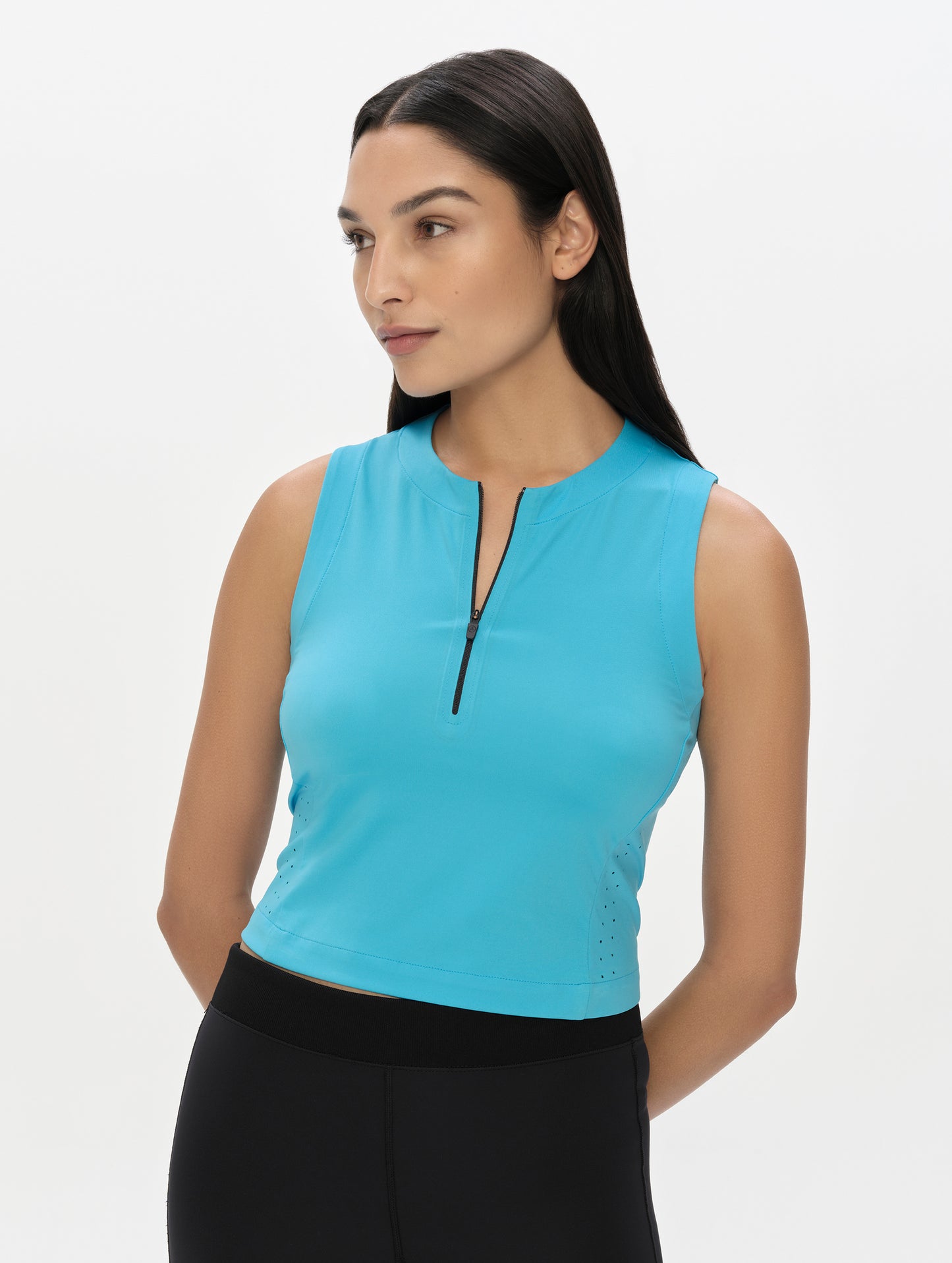 Front, upper-body view of woman wearing the Kora Sunproof Tank Top in Sky Blue from AETHER Apparel.