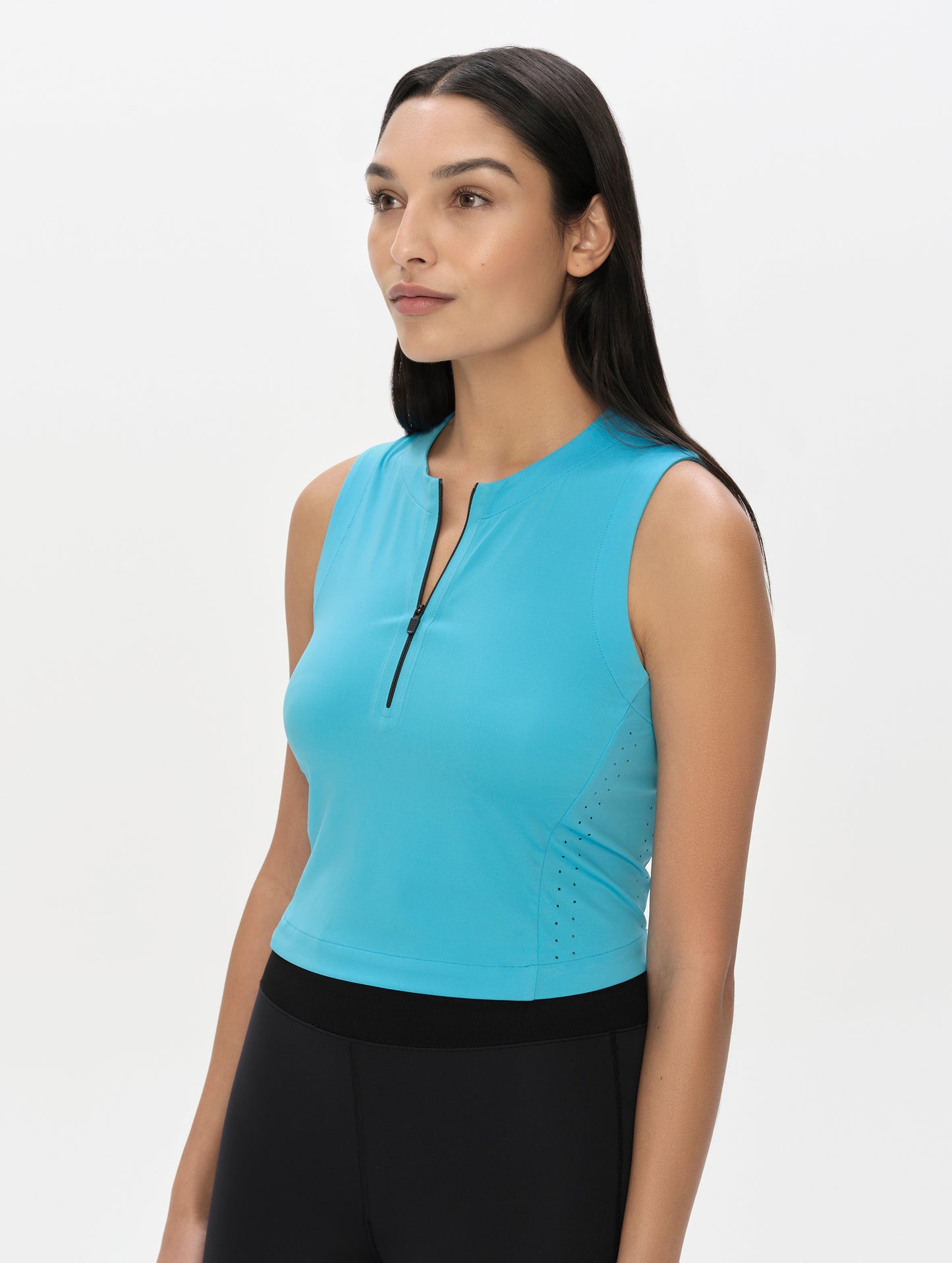Front, 3/4, upper-body view of woman wearing the Kora Sunproof Tank Top in Sky Blue from AETHER Apparel.