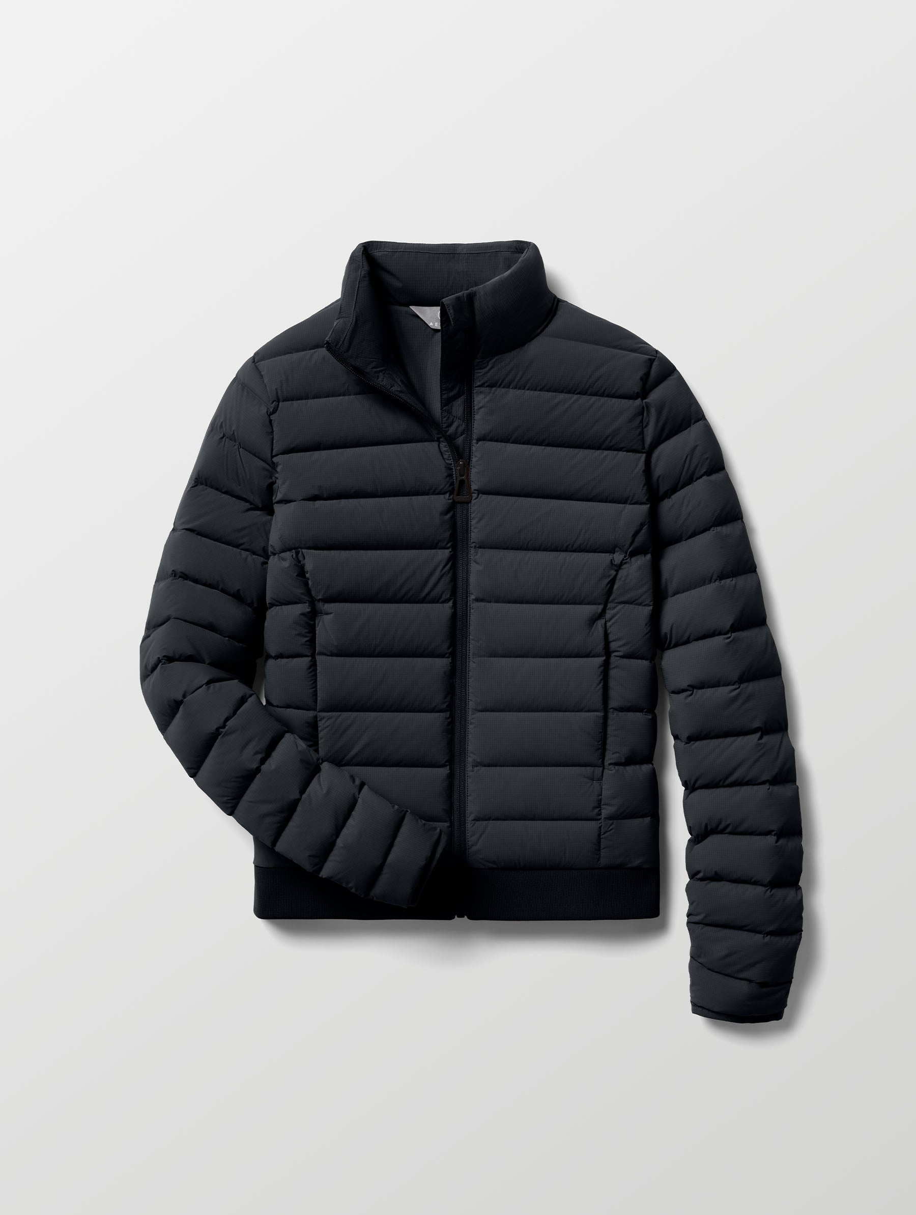 Flat lay of W Launch Full-Zip Jacket NH in Onyx Black from AETHER Apparel.