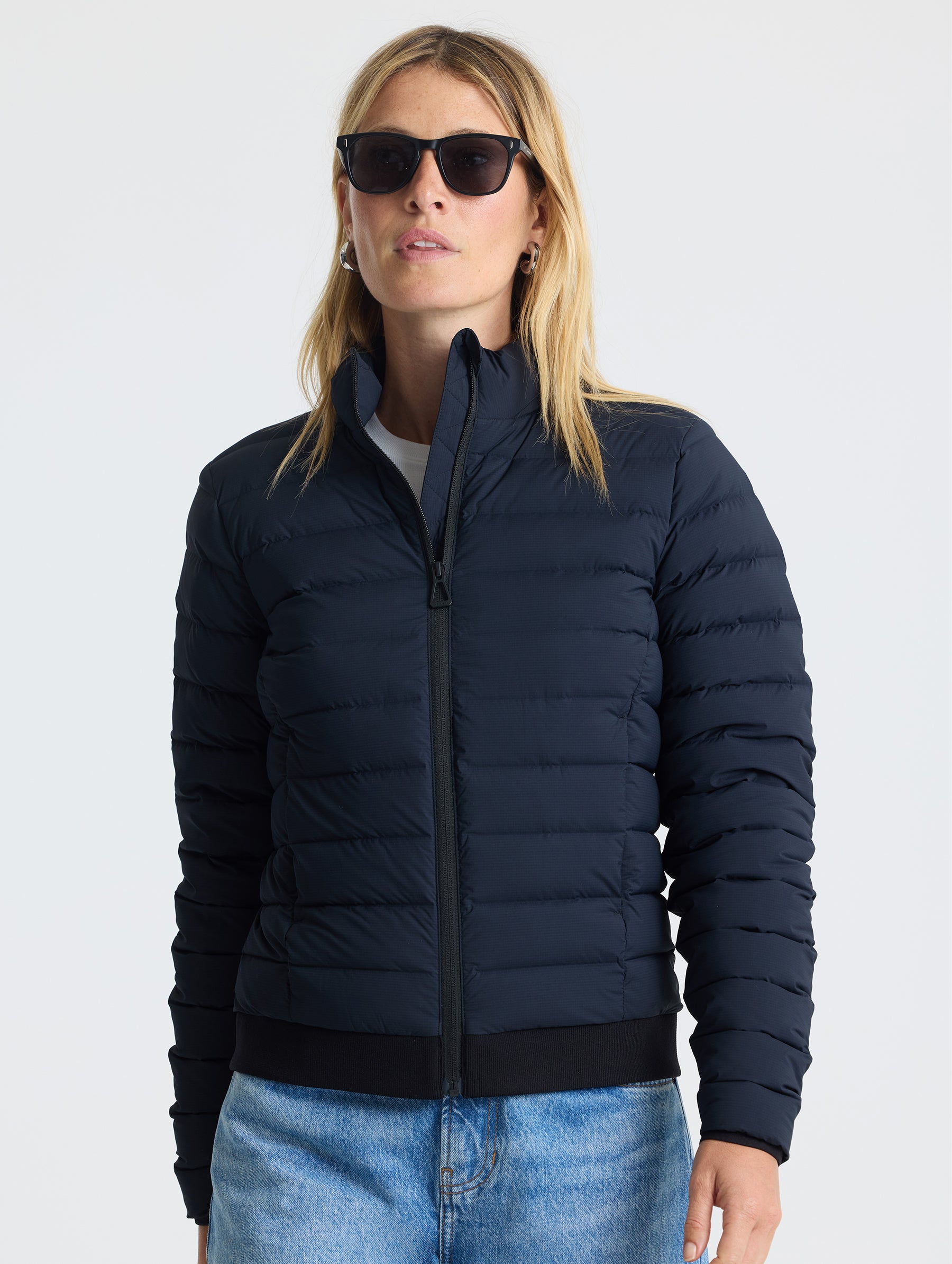 Front view of W Launch Full-Zip Jacket NH in Onyx Black from AETHER Apparel.