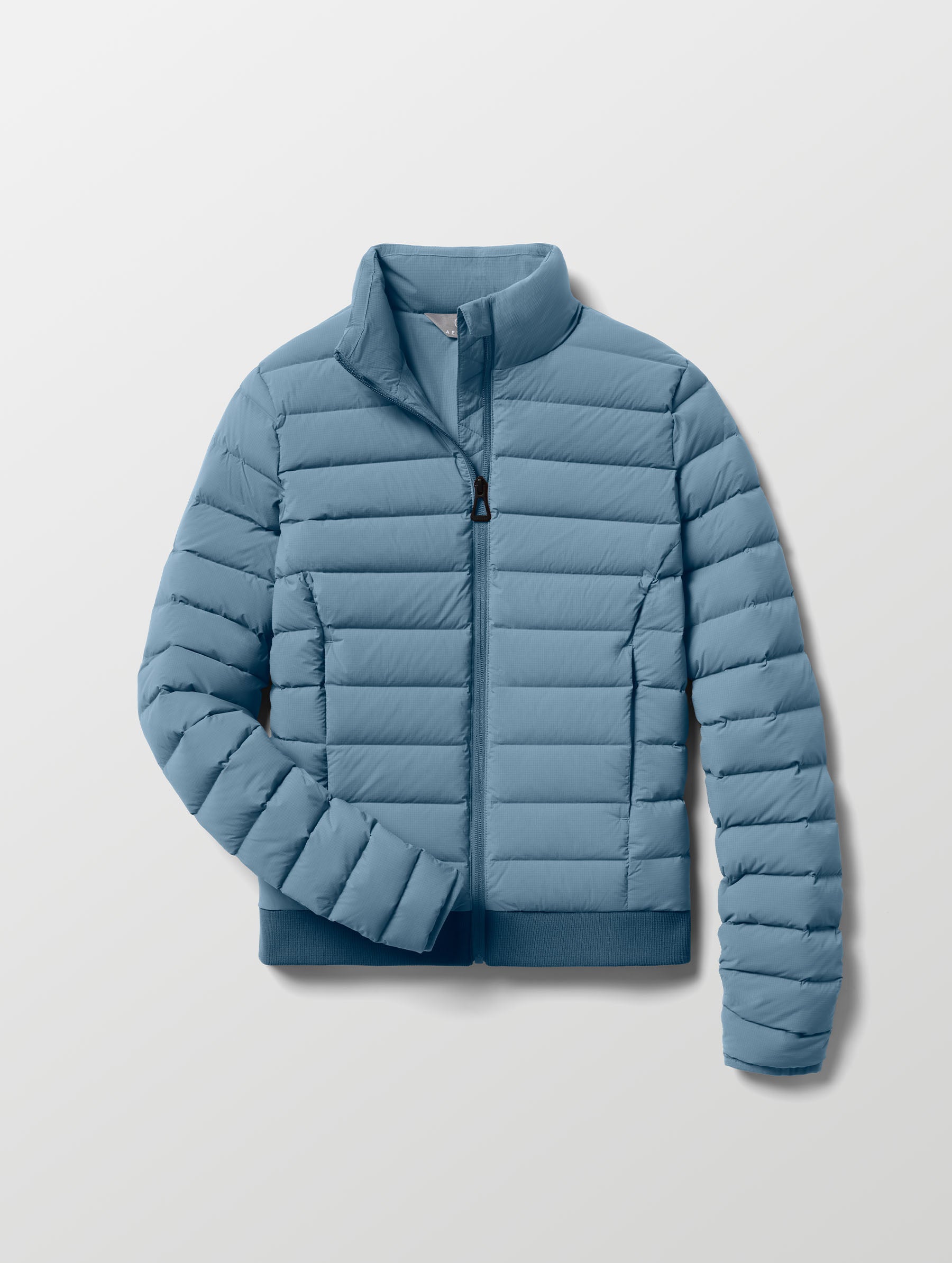 Flat lay of W Launch Full-Zip Jacket NH in Portal Blue from AETHER Apparel.