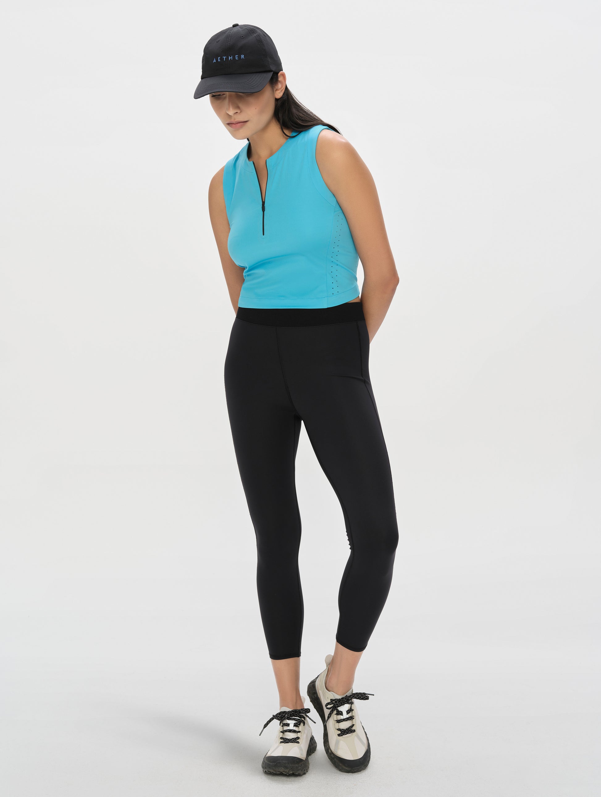 Front, full-body view of woman wearing the Laurel Legging in Onyx Black from AETHER Apparel.
