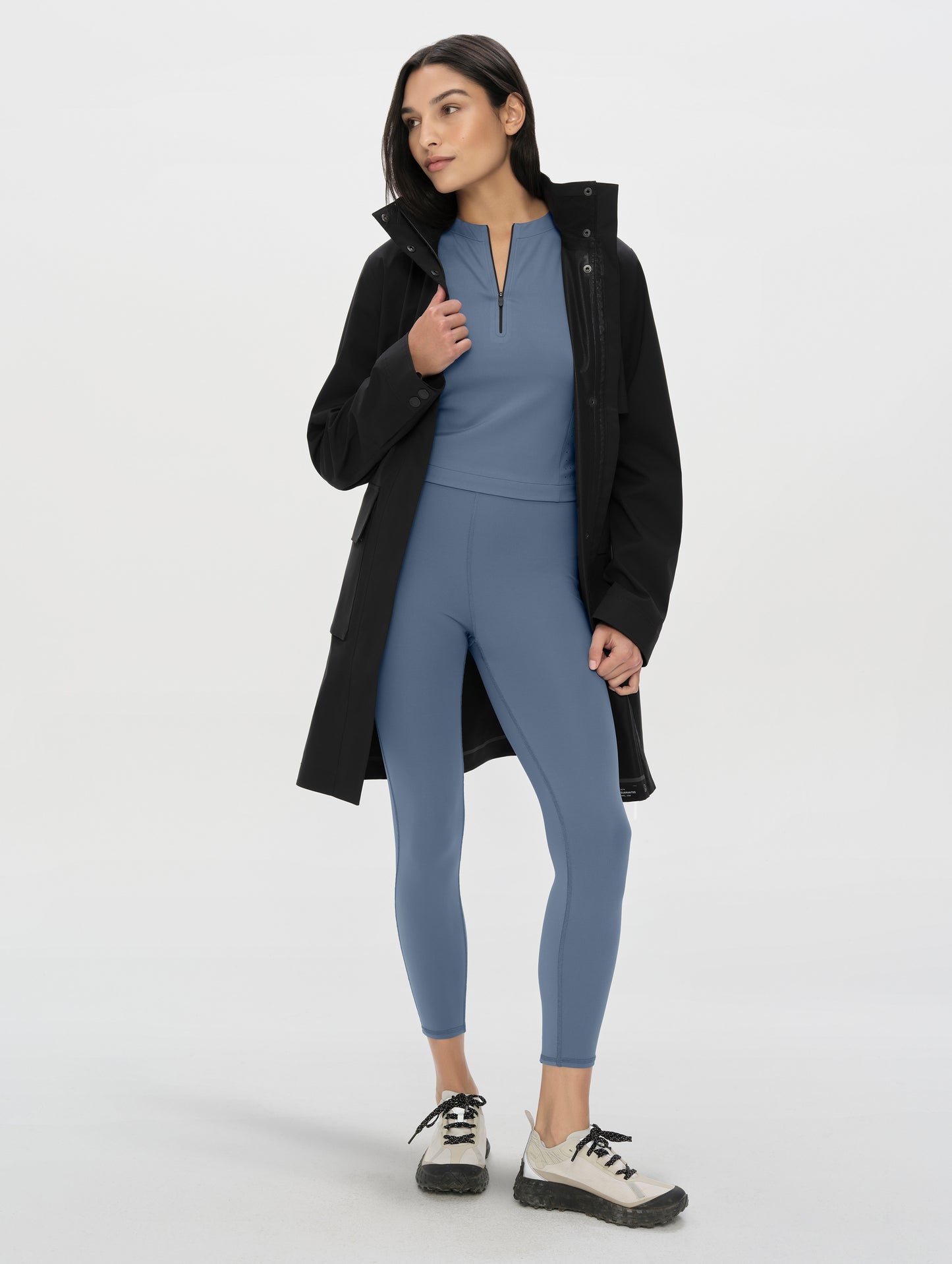 Front, full-body view of woman wearing the Laurel Legging in Portal Blue from AETHER Apparel.