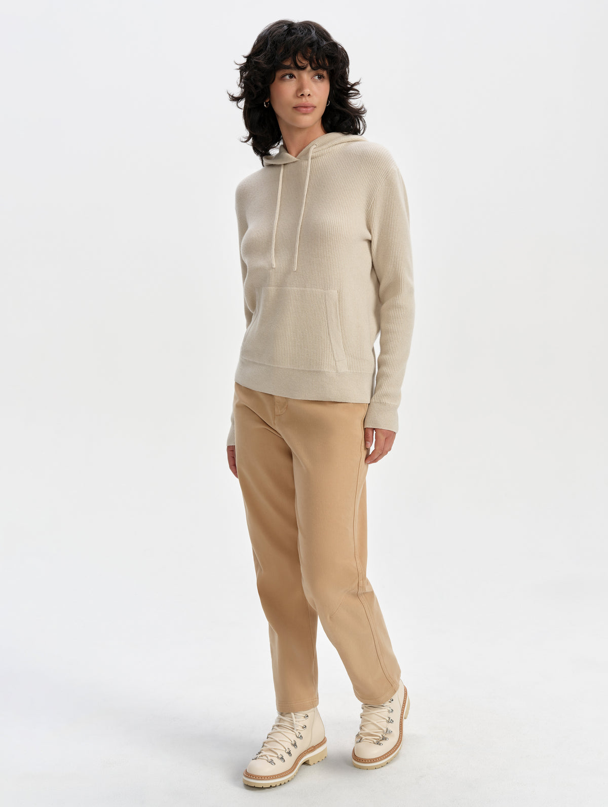 Front full-body view of woman wearing the Lawrence Cashmere Hooded Sweater in Bone from AETHER Apparel.
