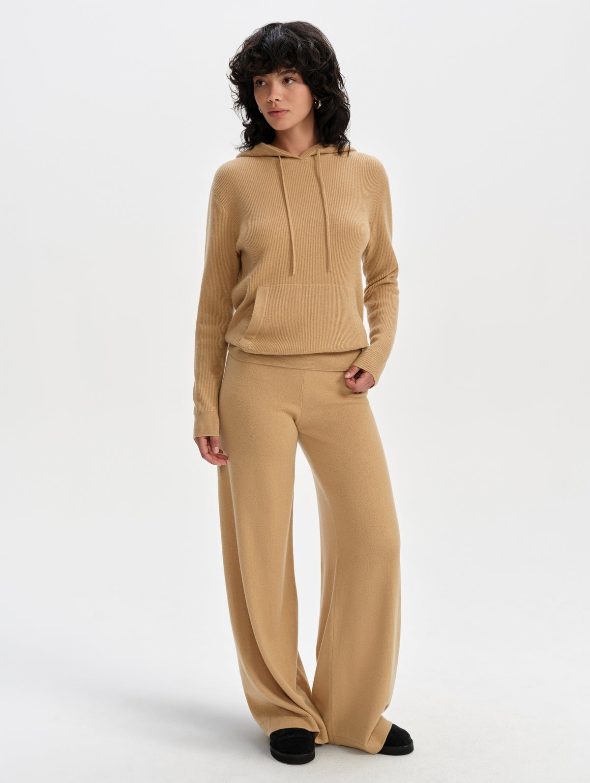 Front full-body view of woman wearing the Lawrence Cashmere Hooded Sweater in Latte Brown from AETHER Apparel.