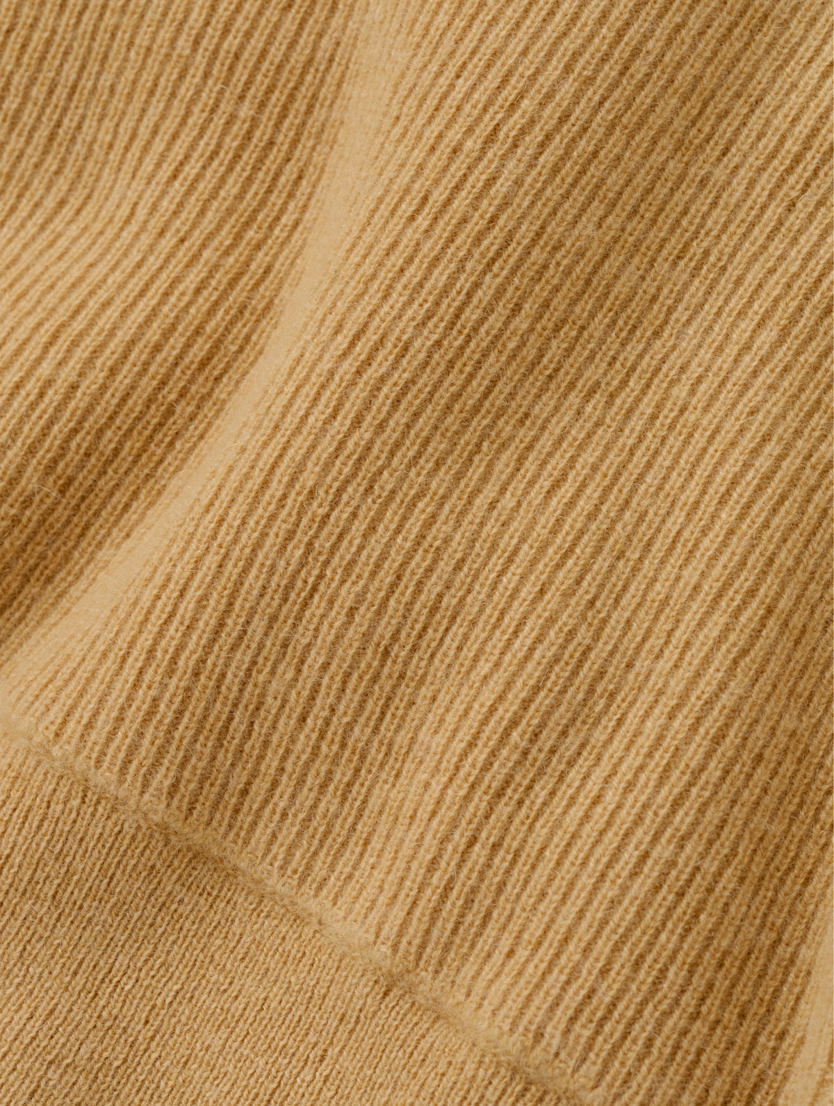 Closeup detailed view of the cashmere construction on the Lawrence Cashmere Hooded Sweater in Latte Brown from AETHER Apparel.