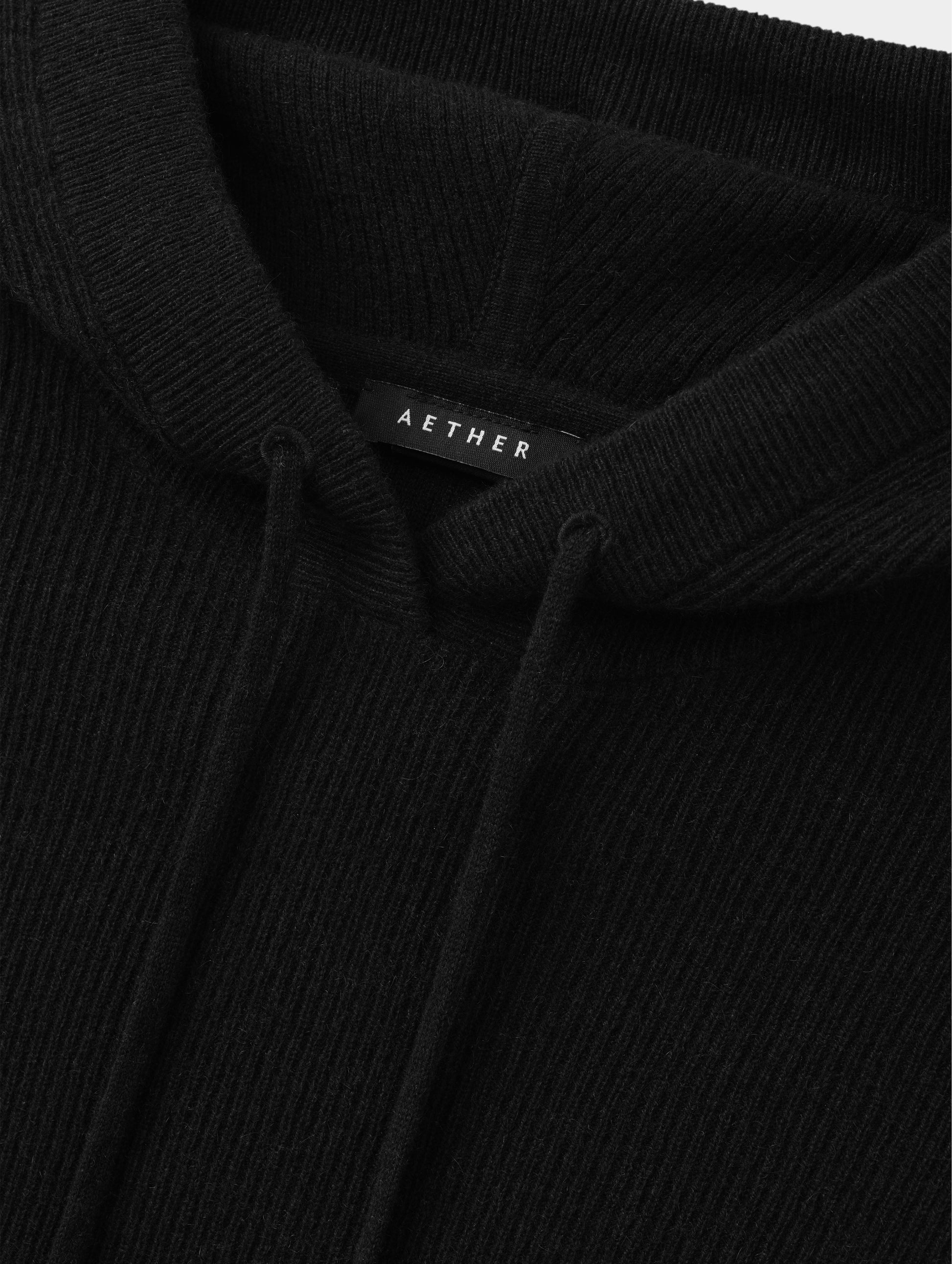 Closeup detailed view of the drawcord on the hood of the Lawrence Cashmere Hooded Sweater in Onyx Black from AETHER Apparel.