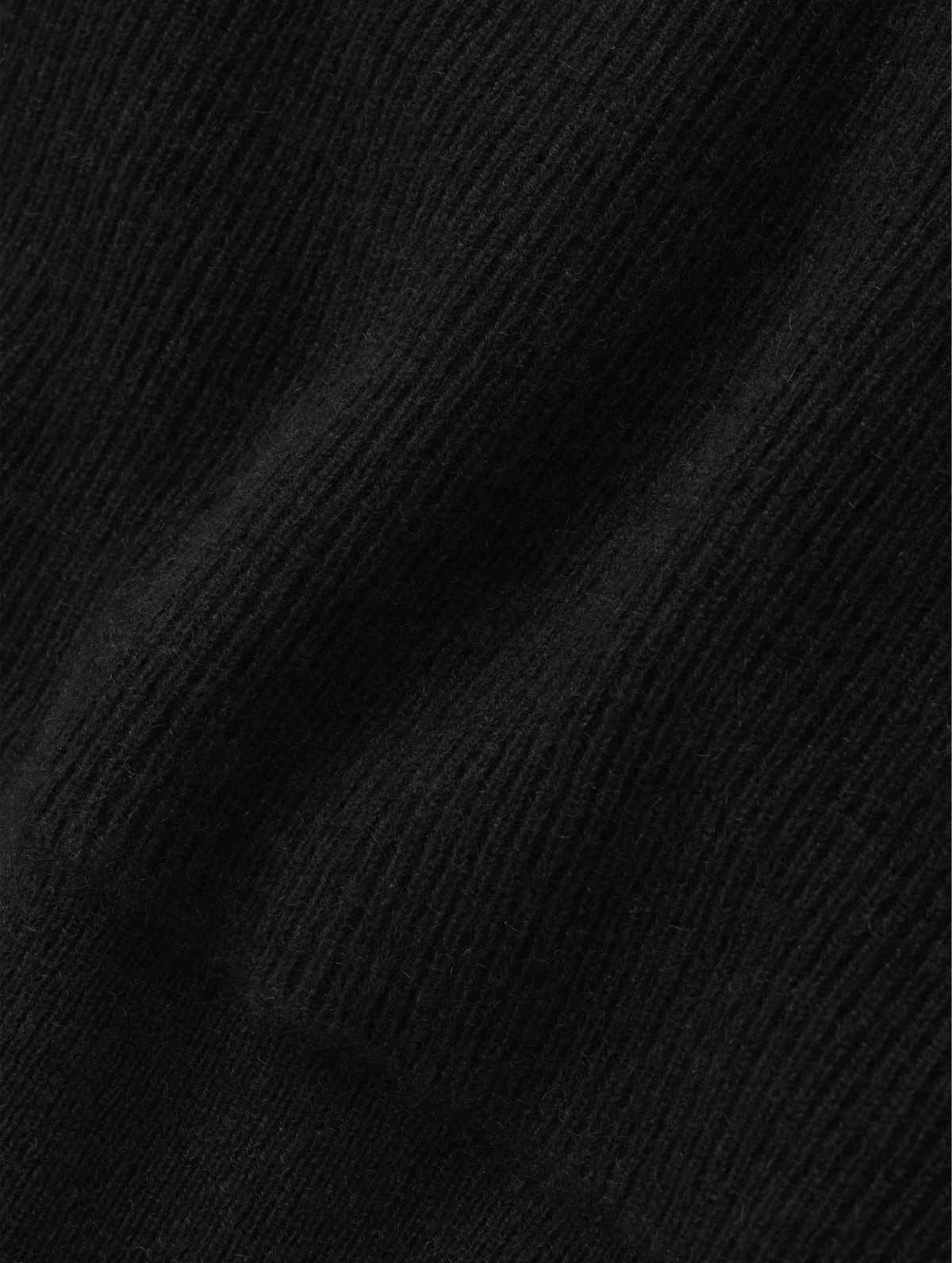 Closeup detailed view of the cashmere construction on the Lawrence Cashmere Hooded Sweater in Onyx Black from AETHER Apparel.