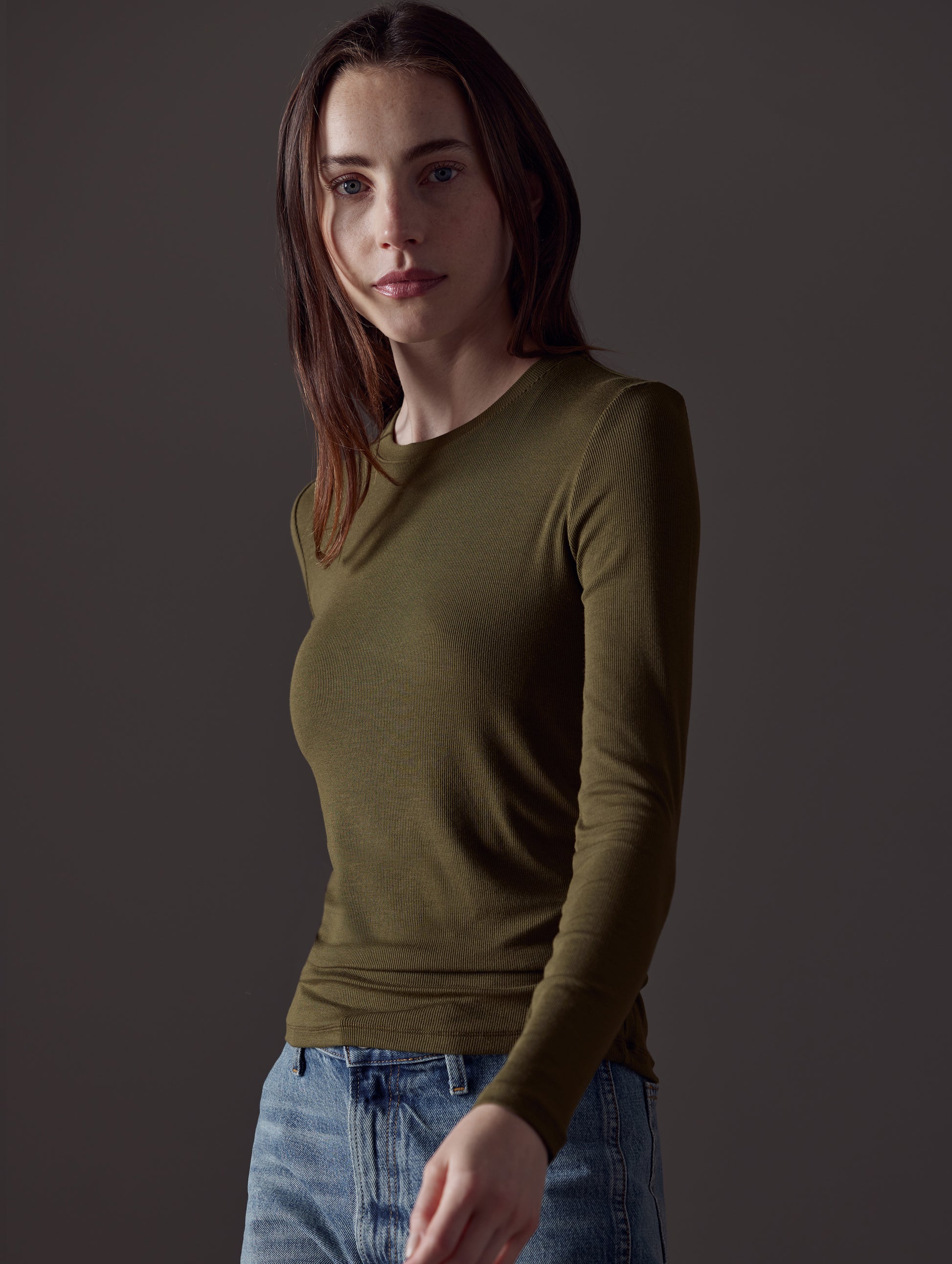woman wearing green long-sleeve shirt from AETHER Apparel