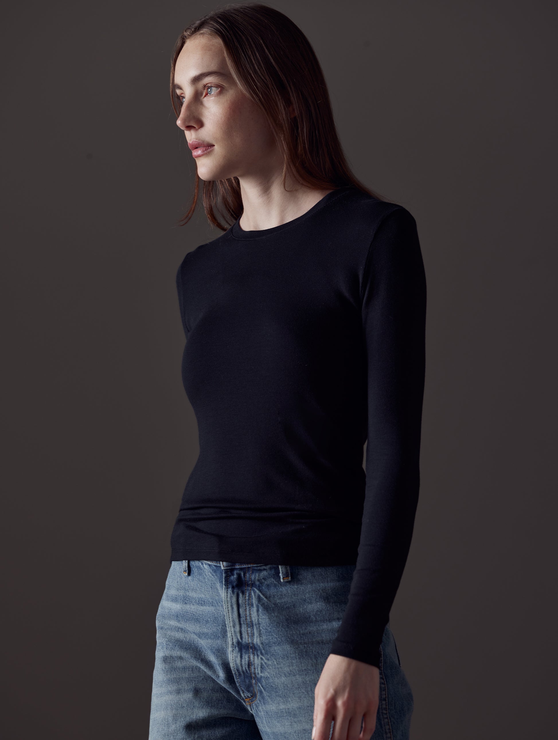 woman wearing black long-sleeve shirt from AETHER Apparel