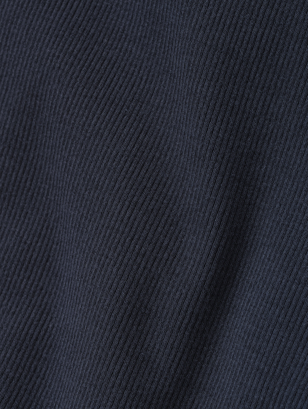 Closeup detailed view of the rib-knit fabric on the Legacy Long-Sleeve Henley in Total Eclipse from AETHER Apparel.