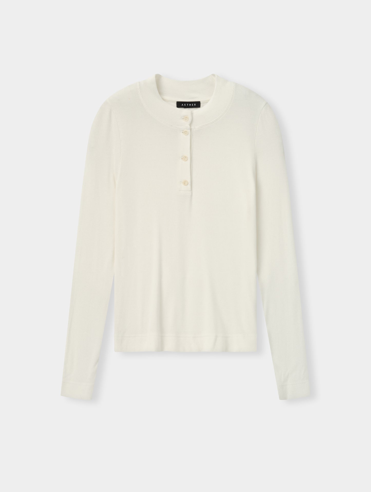 Flat lay view of the Legacy Long-Sleeve Henley in Winter White from AETHER Apparel. 