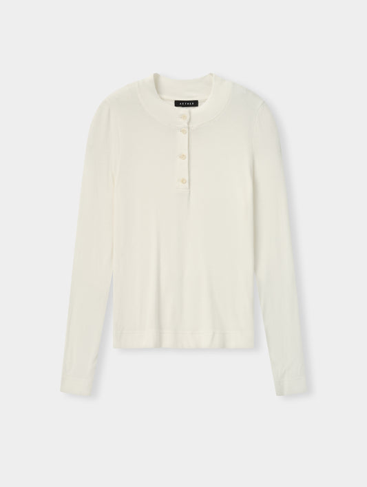 Flat lay view of the Legacy Long-Sleeve Henley in Winter White from AETHER Apparel. 