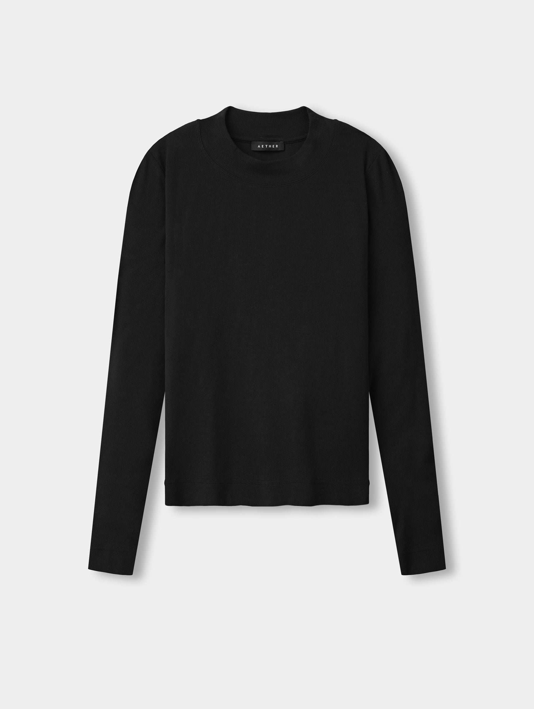 Flat lay view of the Legacy Long-Sleeve Shirt in Onyx Black from AETHER Apparel.