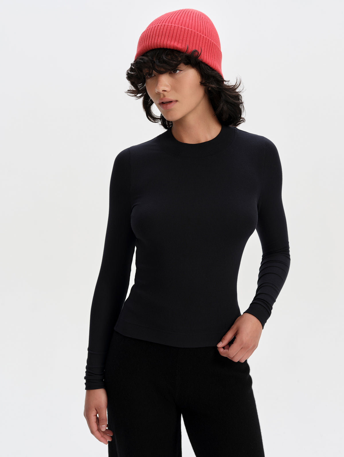 Front upper-body view of woman wearing the Legacy Long-Sleeve Shirt in Winter White from AETHER Apparel.