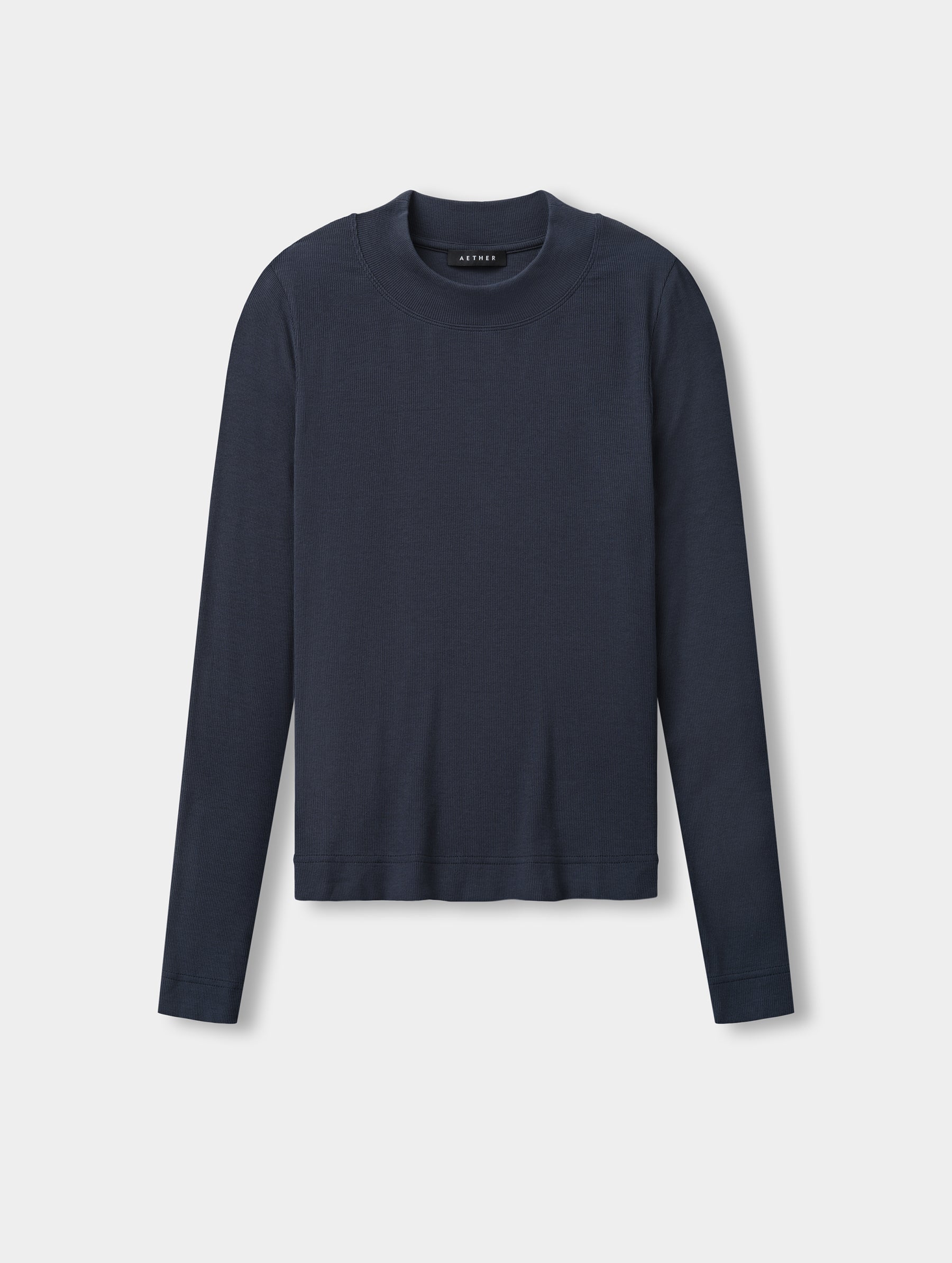 Flat lay view of the Legacy Long-Sleeve Shirt in Total Eclipse from AETHER Apparel.