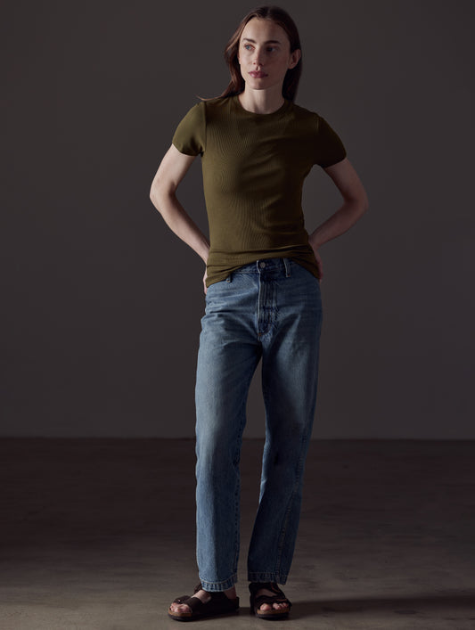 woman wearing green short-sleeve shirt from AETHER Apparel