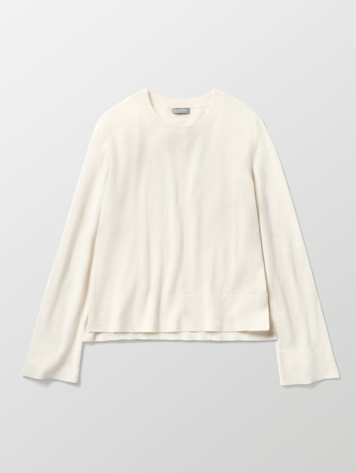 Flat lay image of Leigh Cashmere Crewneck in Winter White from AETHER Apparel. 