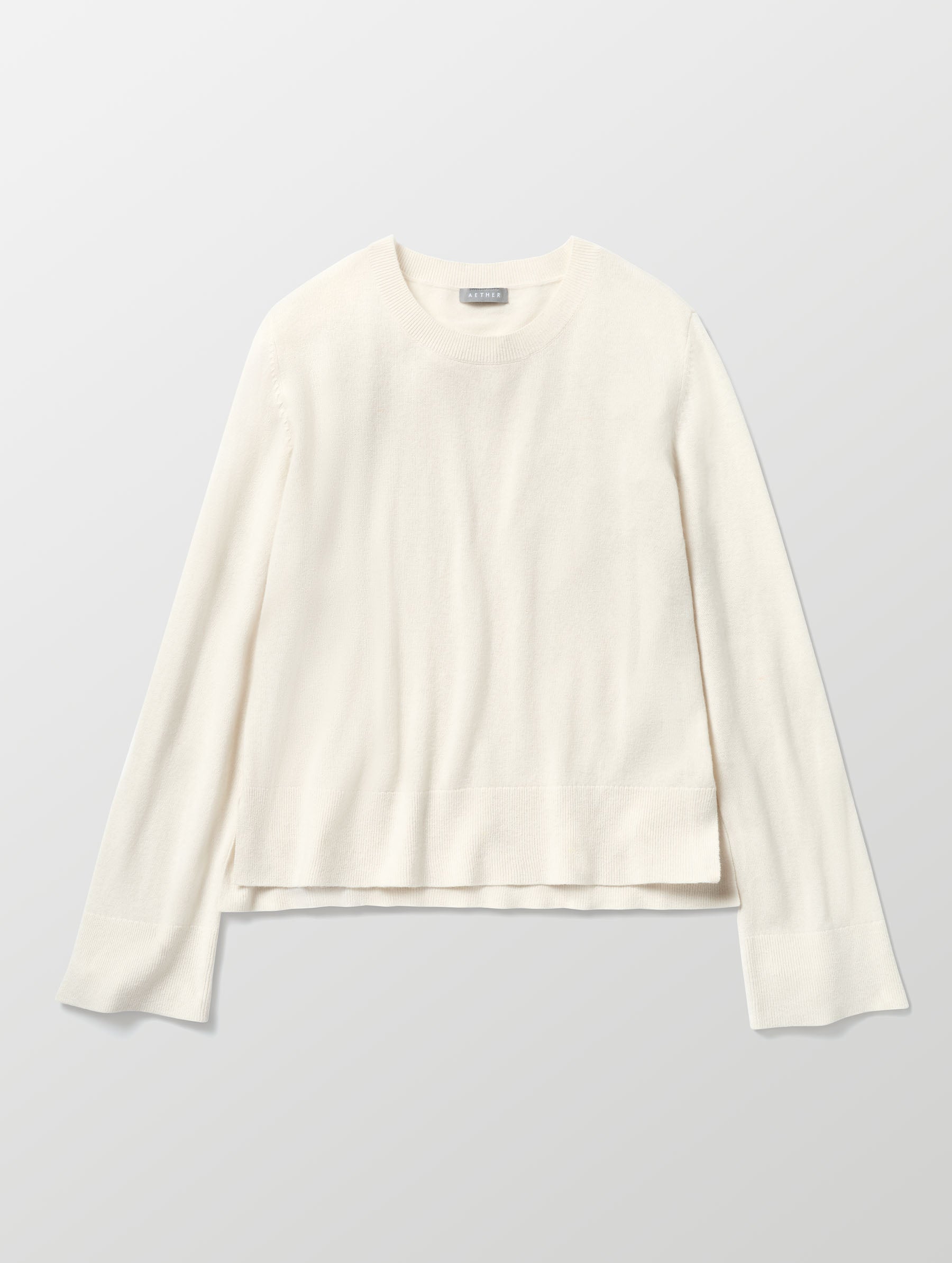 Flat lay image of Leigh Cashmere Crewneck in Winter White from AETHER Apparel. 