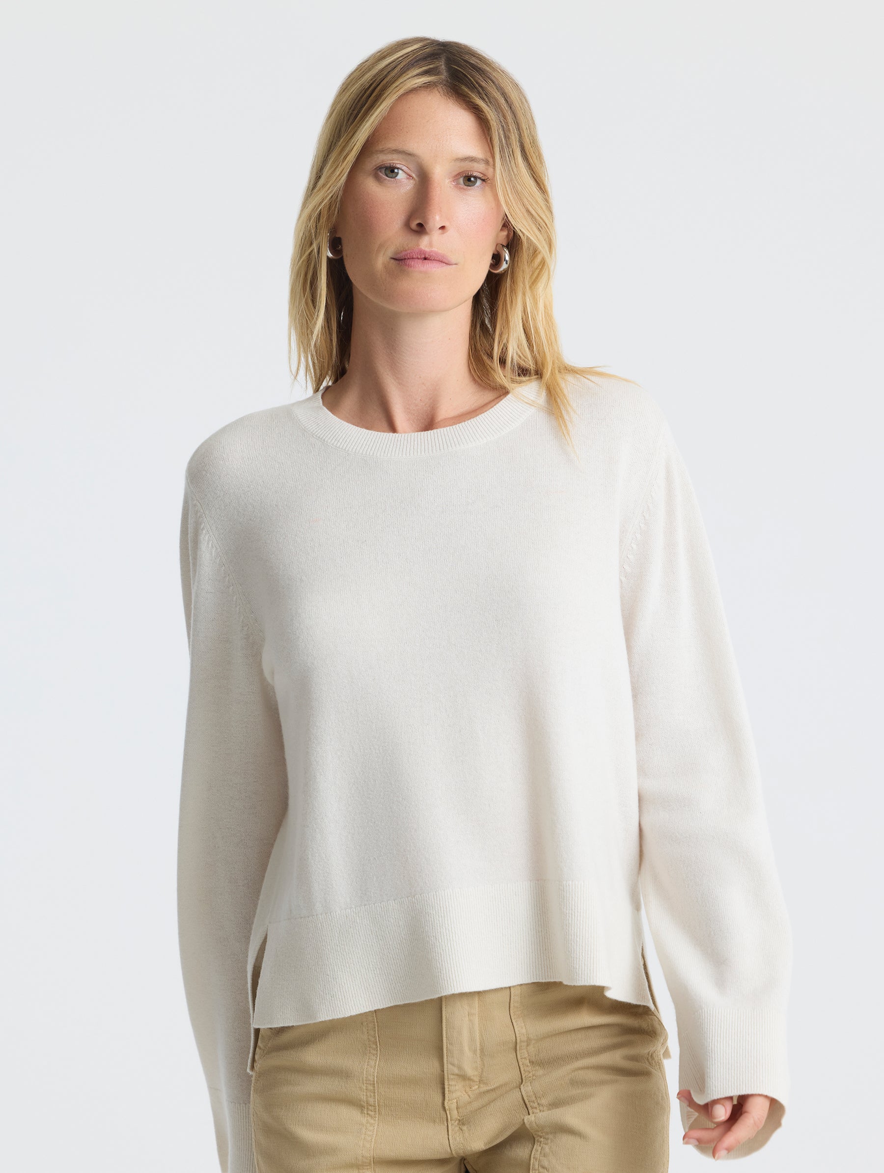 Front upper body view of woman wearing Leigh Cashmere Crewneck in Winter White from AETHER Apparel.