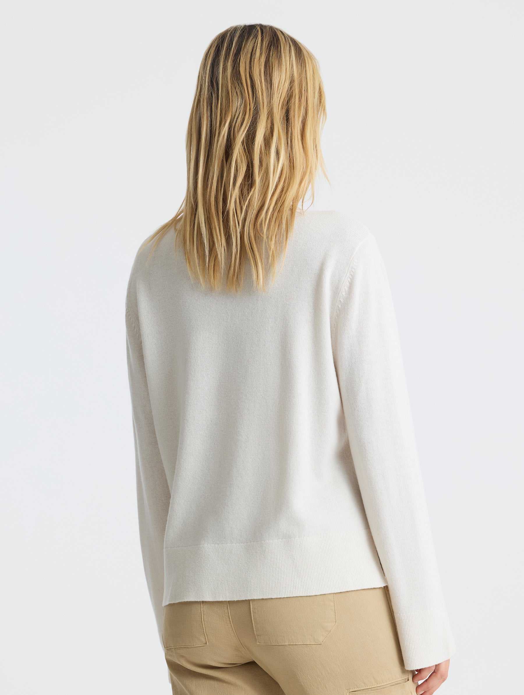 Rear view of woman wearing Leigh Cashmere Crewneck in Winter White from AETHER Apparel.