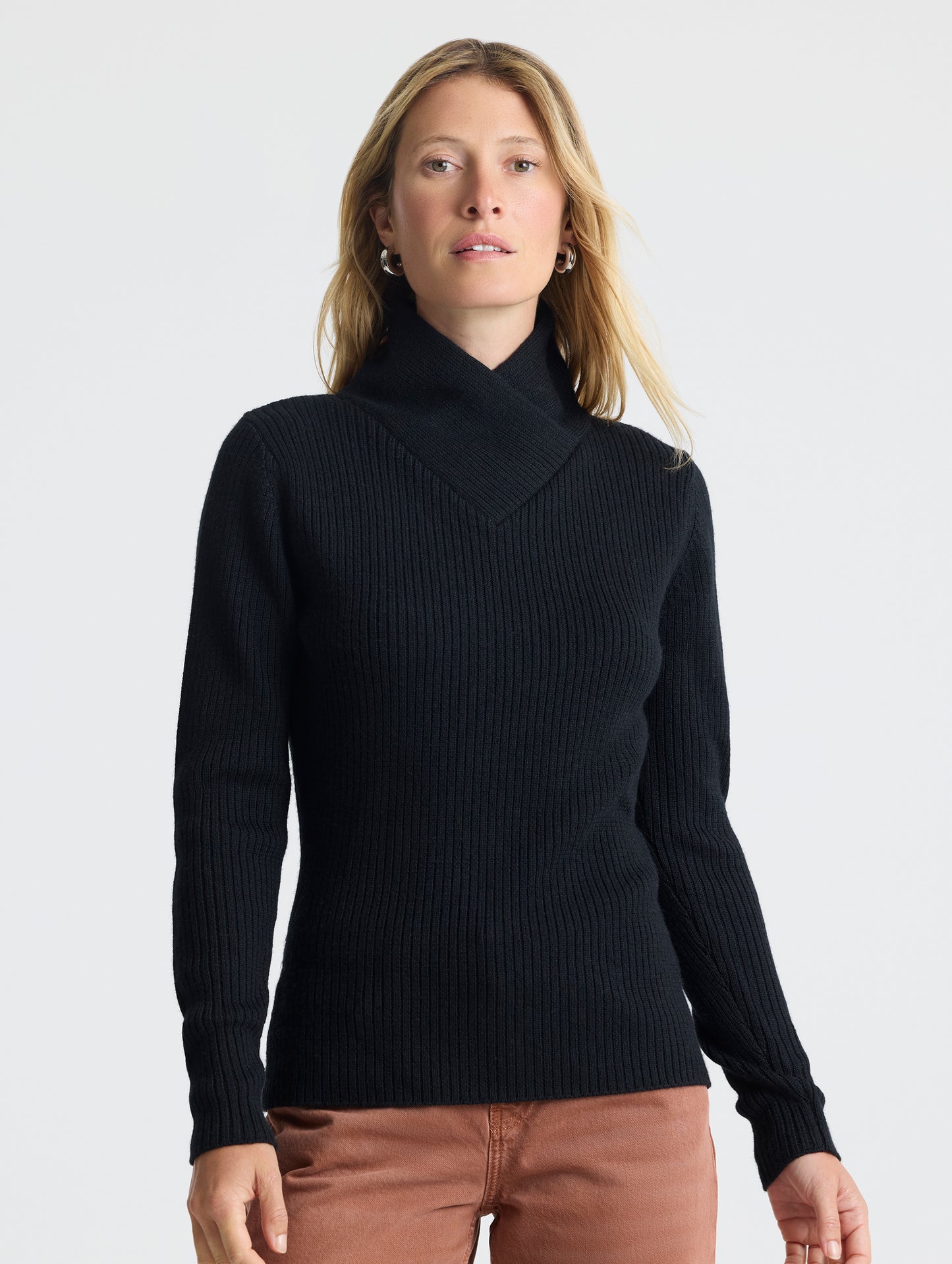 Upper body view of woman wearing Lexington Sweater in Onyx Black from AETHER Apparel.