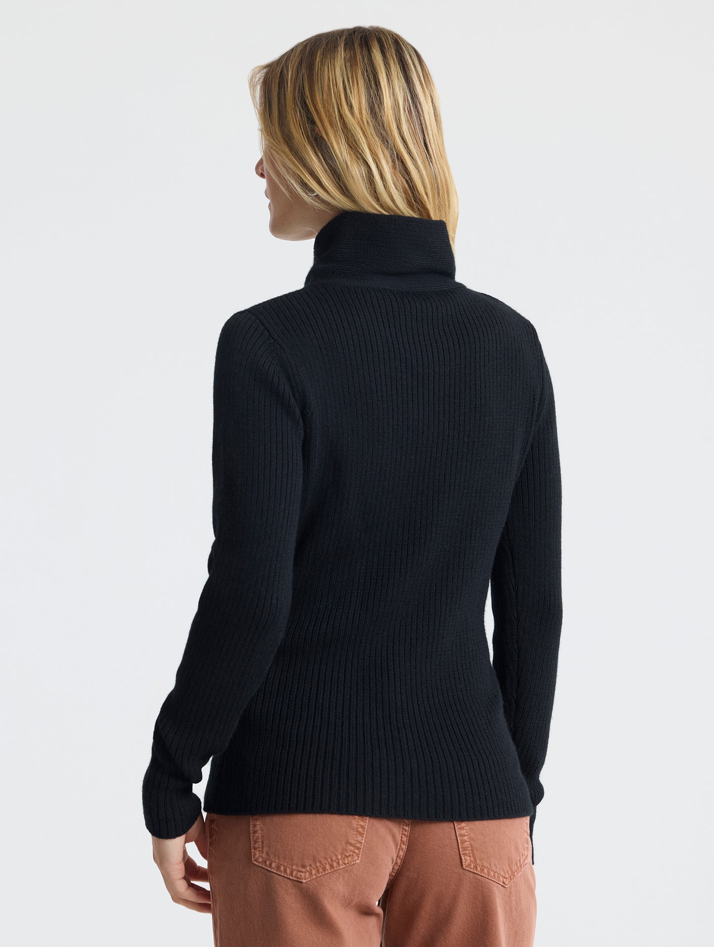 Rear view of woman wearing Lexington Sweater in Onyx Black from AETHER Apparel.