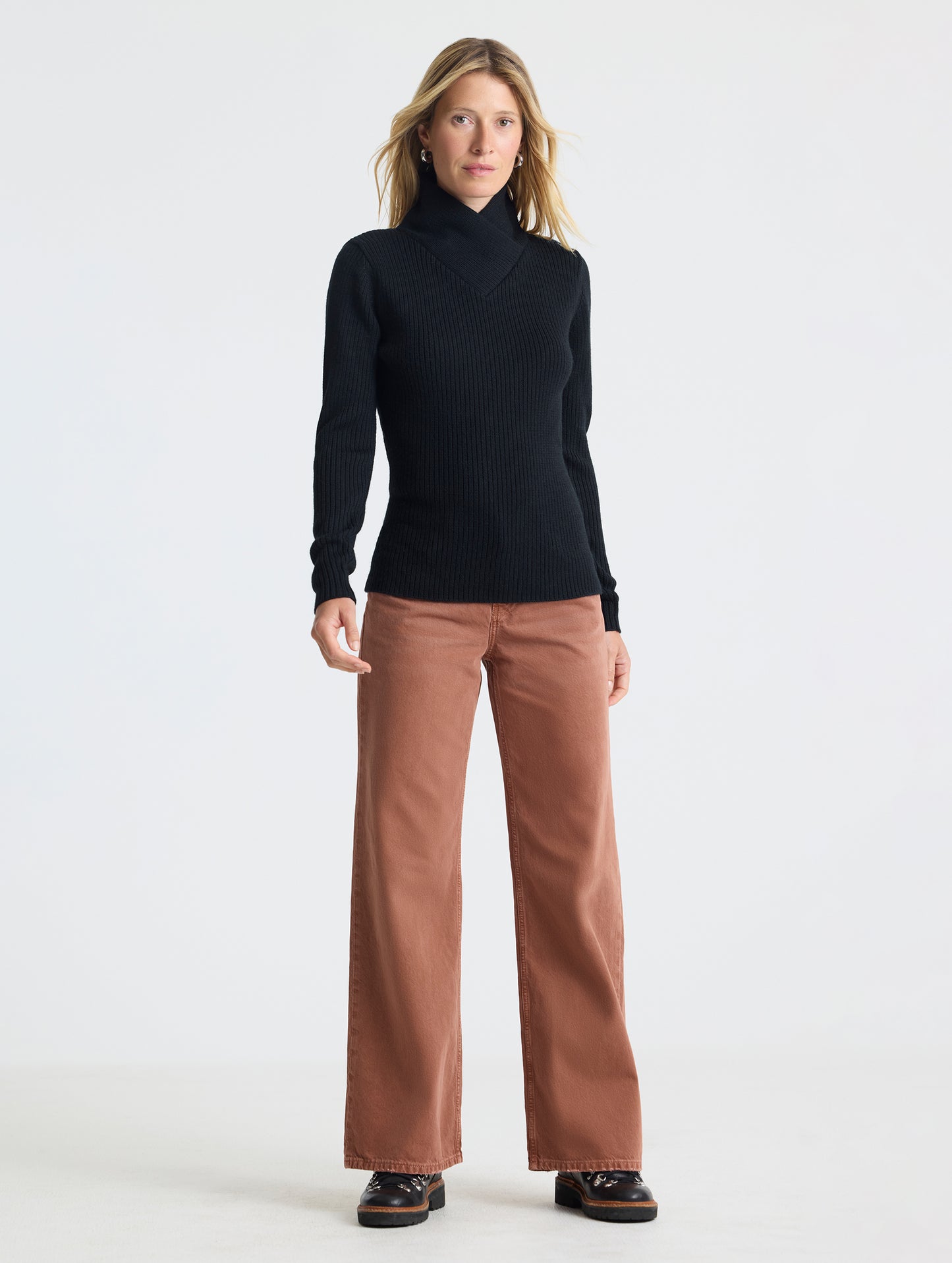 Full body view of woman wearing Lexington Sweater in Onyx Black from AETHER Apparel.
