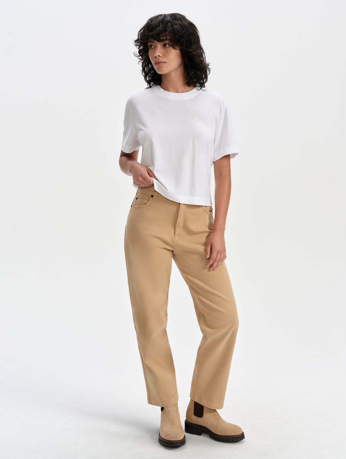 Front full-body view of woman wearing the Lola Relaxed Tee in White from AETHER Apparel.