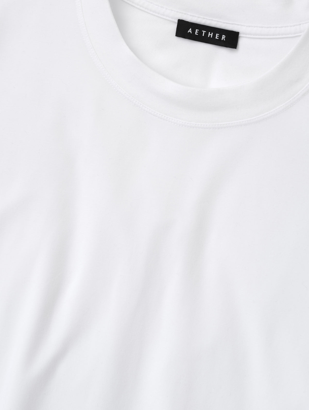 Closeup detailed view of the collar on the Lola Relaxed Tee in White from AETHER Apparel.