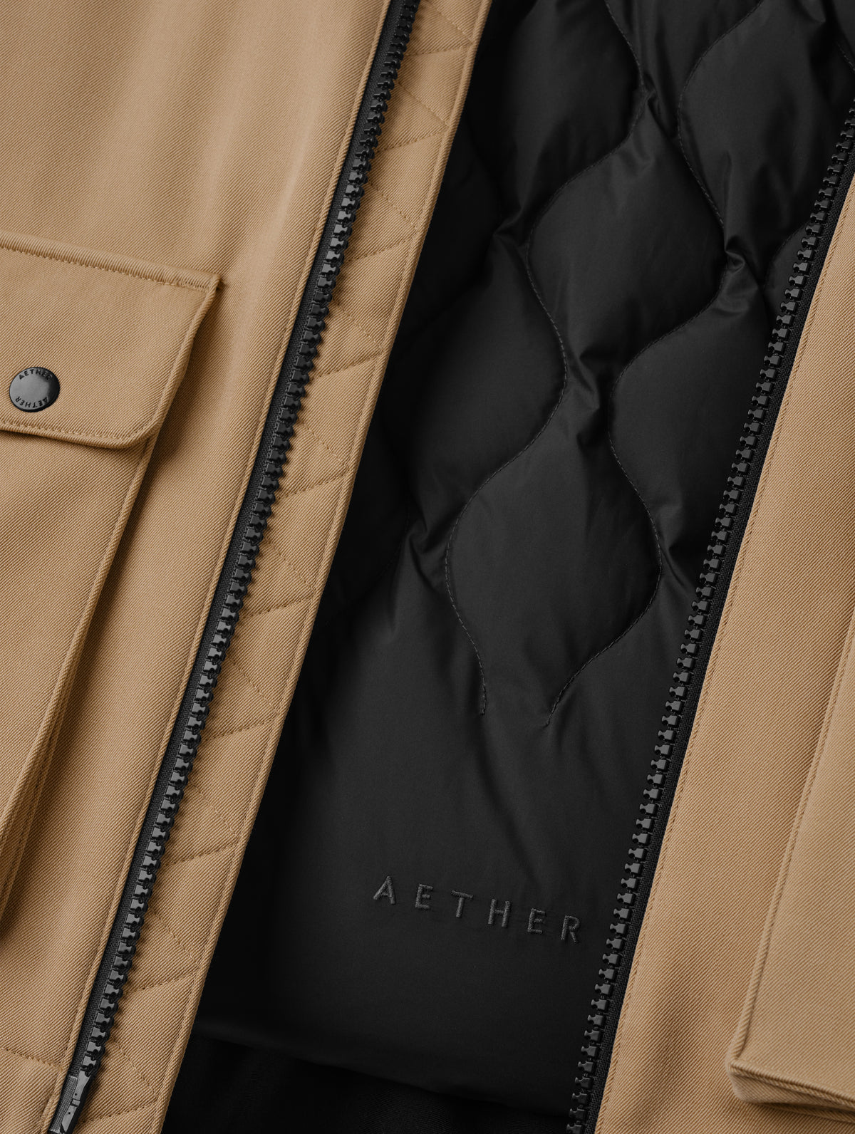 Closeup detailed view of the removable insulated thermal liner on the Luna 3-in-1 Field Jacket in Latte Brown from AETHER Apparel.