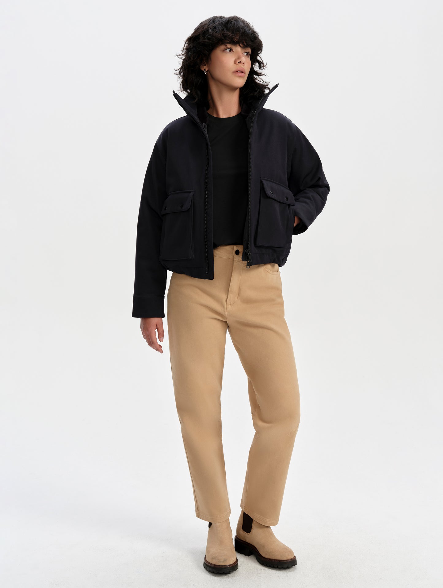 Front full-body view of woman wearing the Luna 3-in-1 Field Jacket in Onyx Black from AETHER Apparel.
