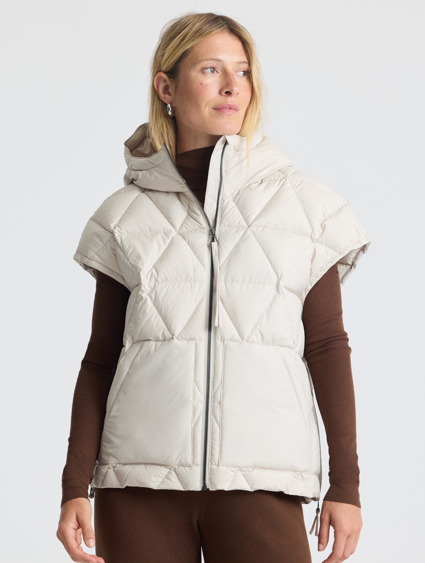 Upper body view of woman wearing Mailen Oversized Vest in Bone White from AETHER Apparel.
