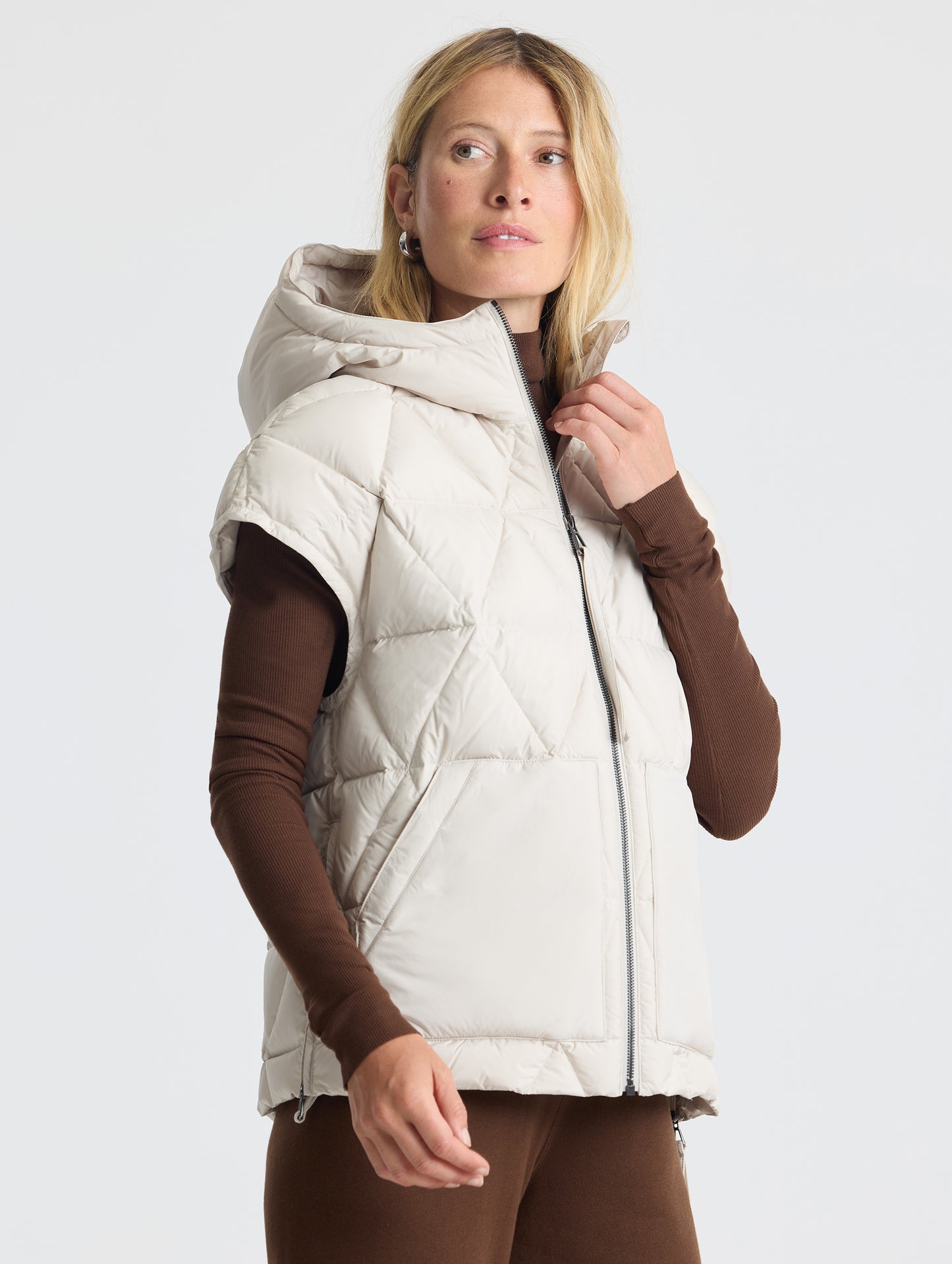 Upper body 3/4 view of woman wearing Mailen Oversized Vest in Bone White from AETHER Apparel.