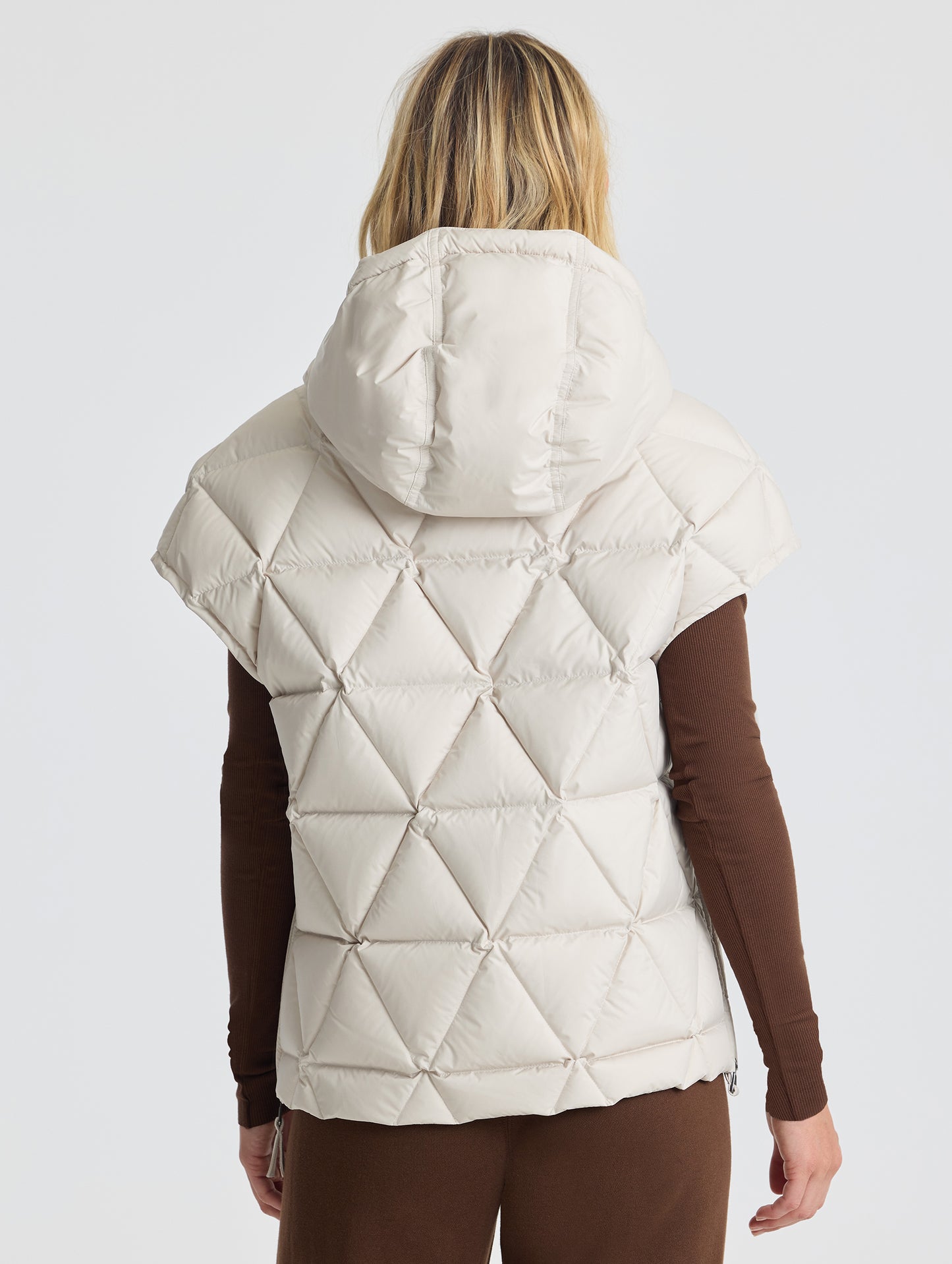 Rear view of woman wearing Mailen Oversized Vest in Bone White from AETHER Apparel.