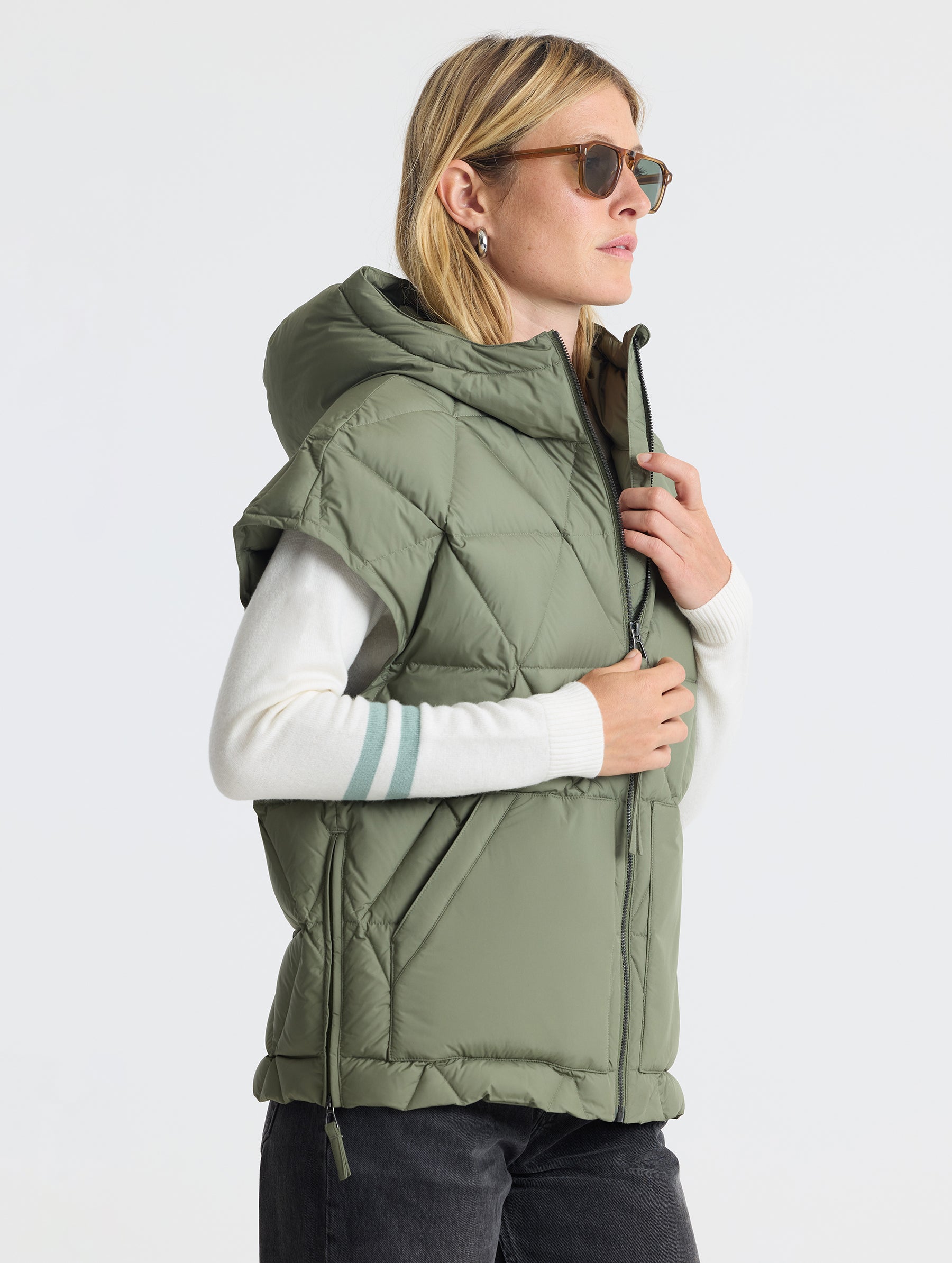 Right profile view of woman wearing Mailen Oversized Vest in Fern Green from AETHER Apparel.