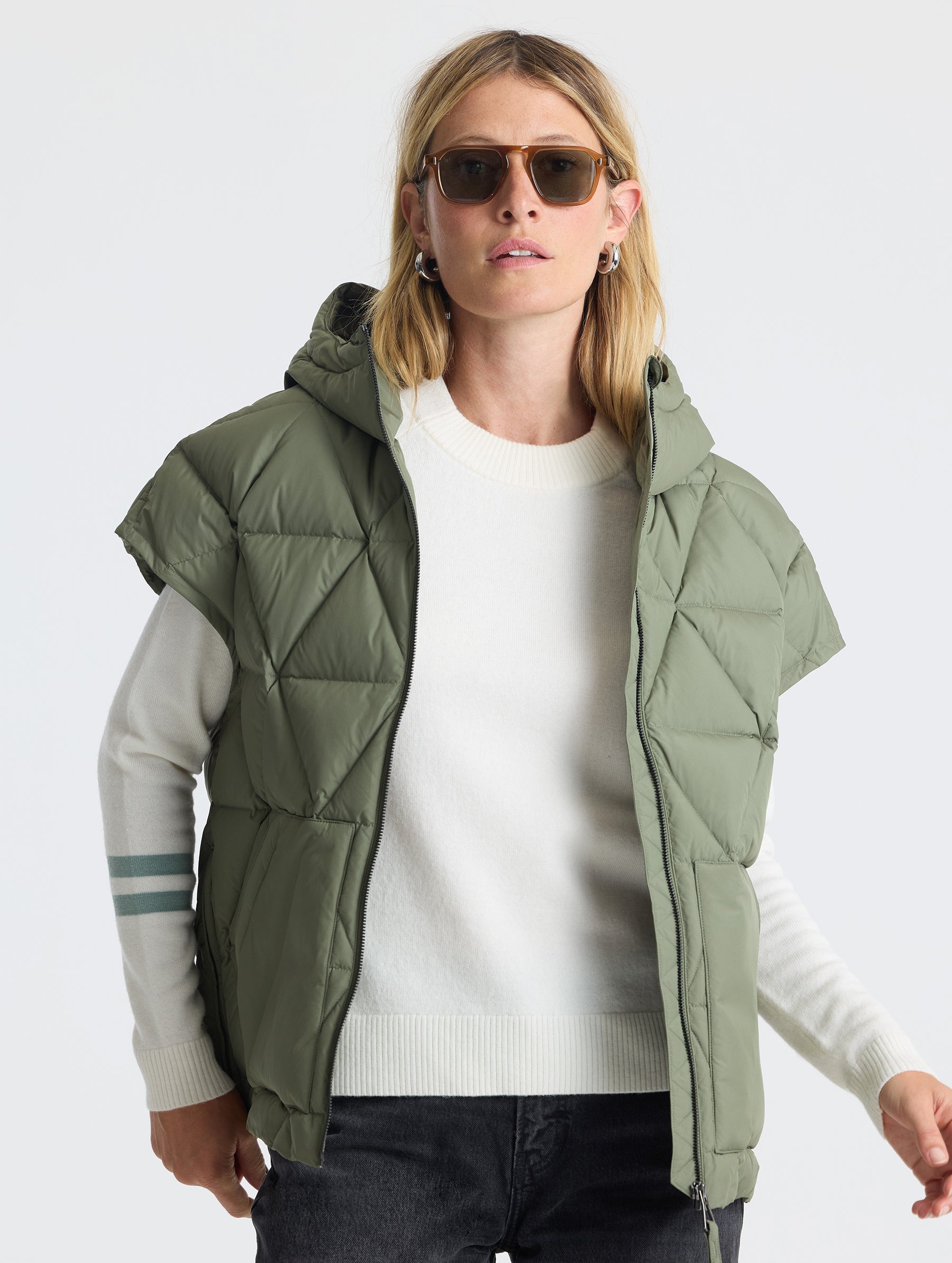 Upper body view of woman wearing unzipped Mailen Oversized Vest in Fern Green from AETHER Apparel.