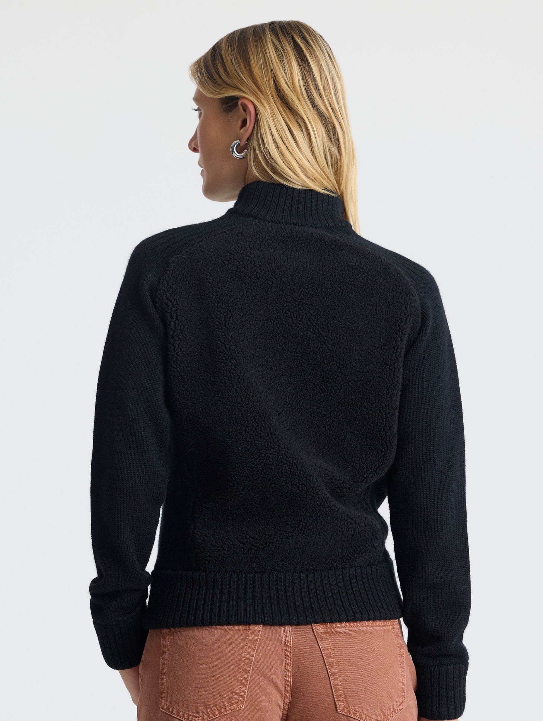 Rear view of woman wearing Malina Half-Zip Sweater in Onyx Black from AETHER Apparel.