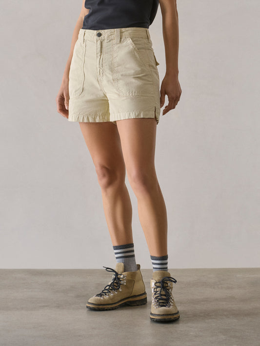 Front 3/4 lower body view of woman wearing Masai Safari Short in Bone white from AETHER Apparel.