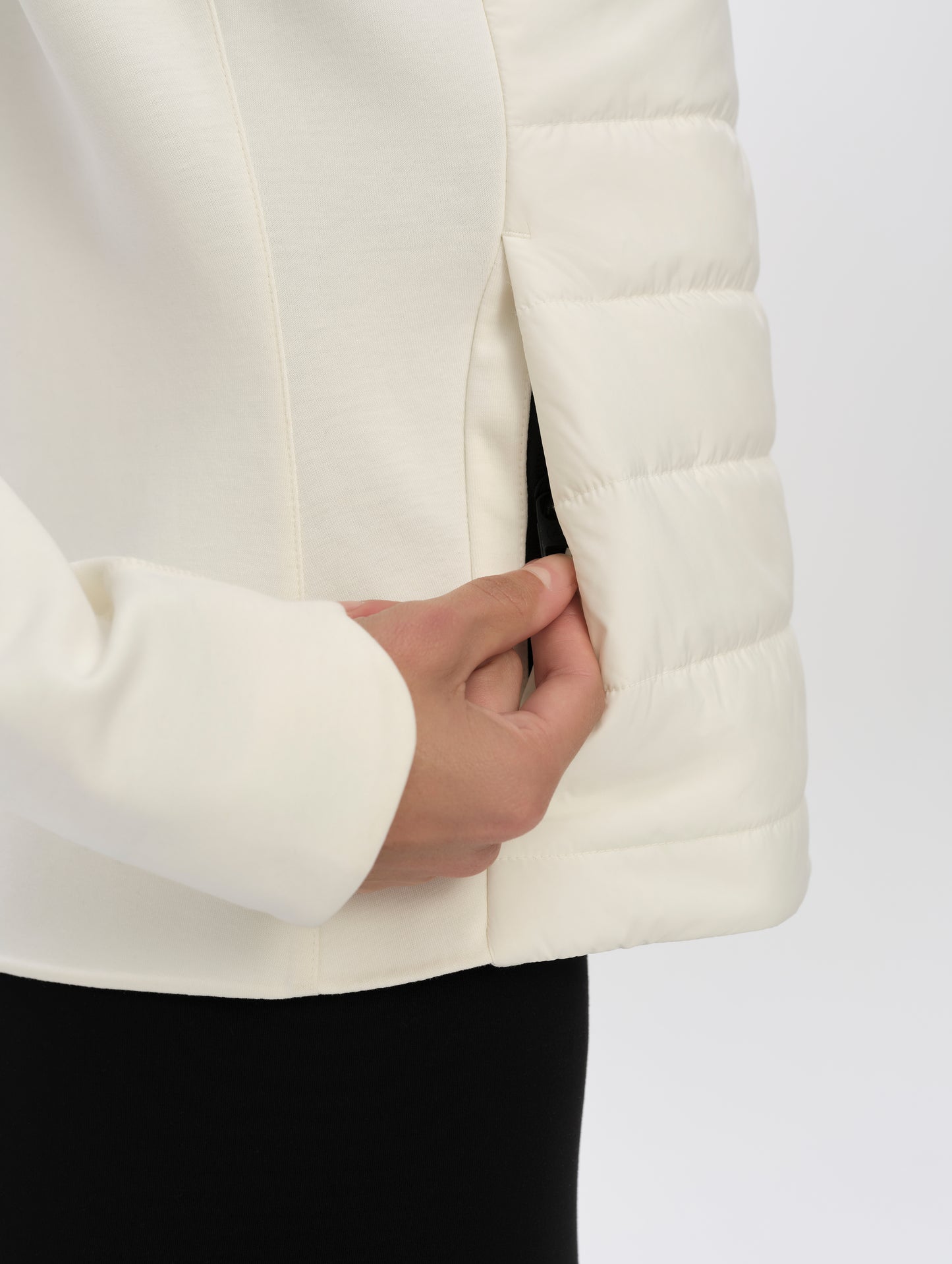 Closeup detailed view of zipper-secured hand pocket on the W Morgan Full-Zip 2.0 in Winter White from AETHER Apparel.