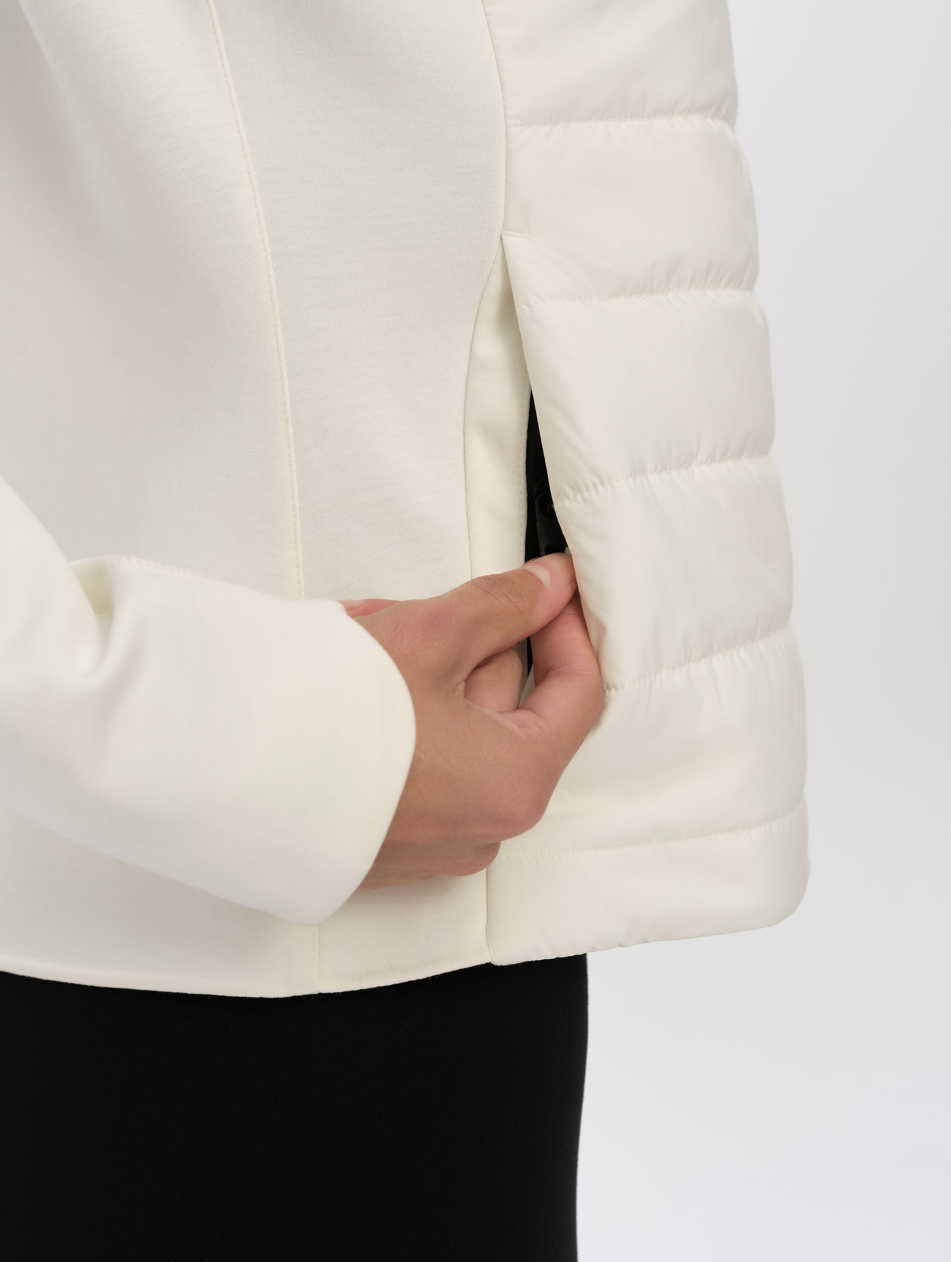 Closeup detailed view of zipper-secured hand pocket on the W Morgan Full-Zip 2.0 in Winter White from AETHER Apparel.