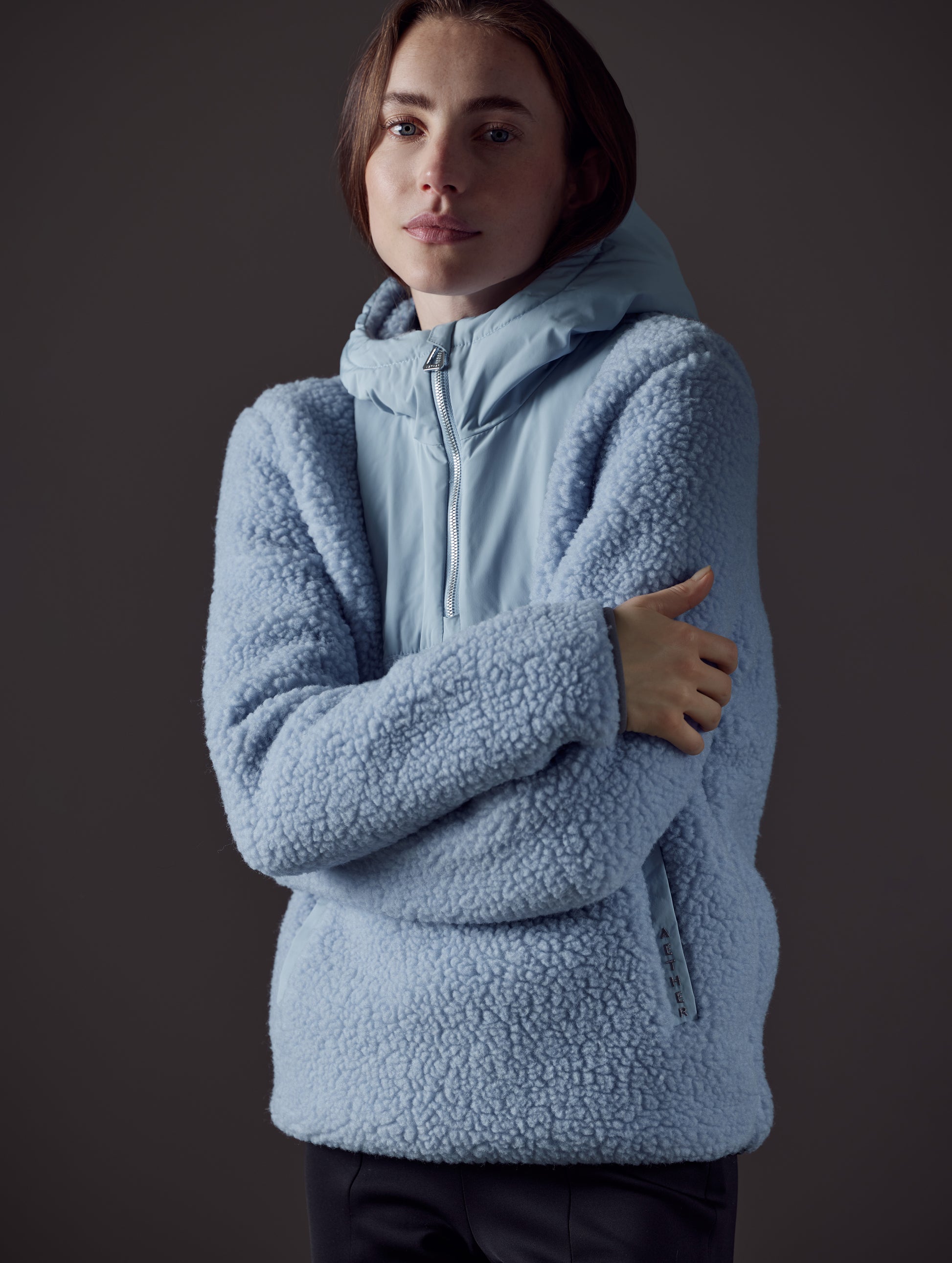 woman wearing blue pullover from AETHER Apparel