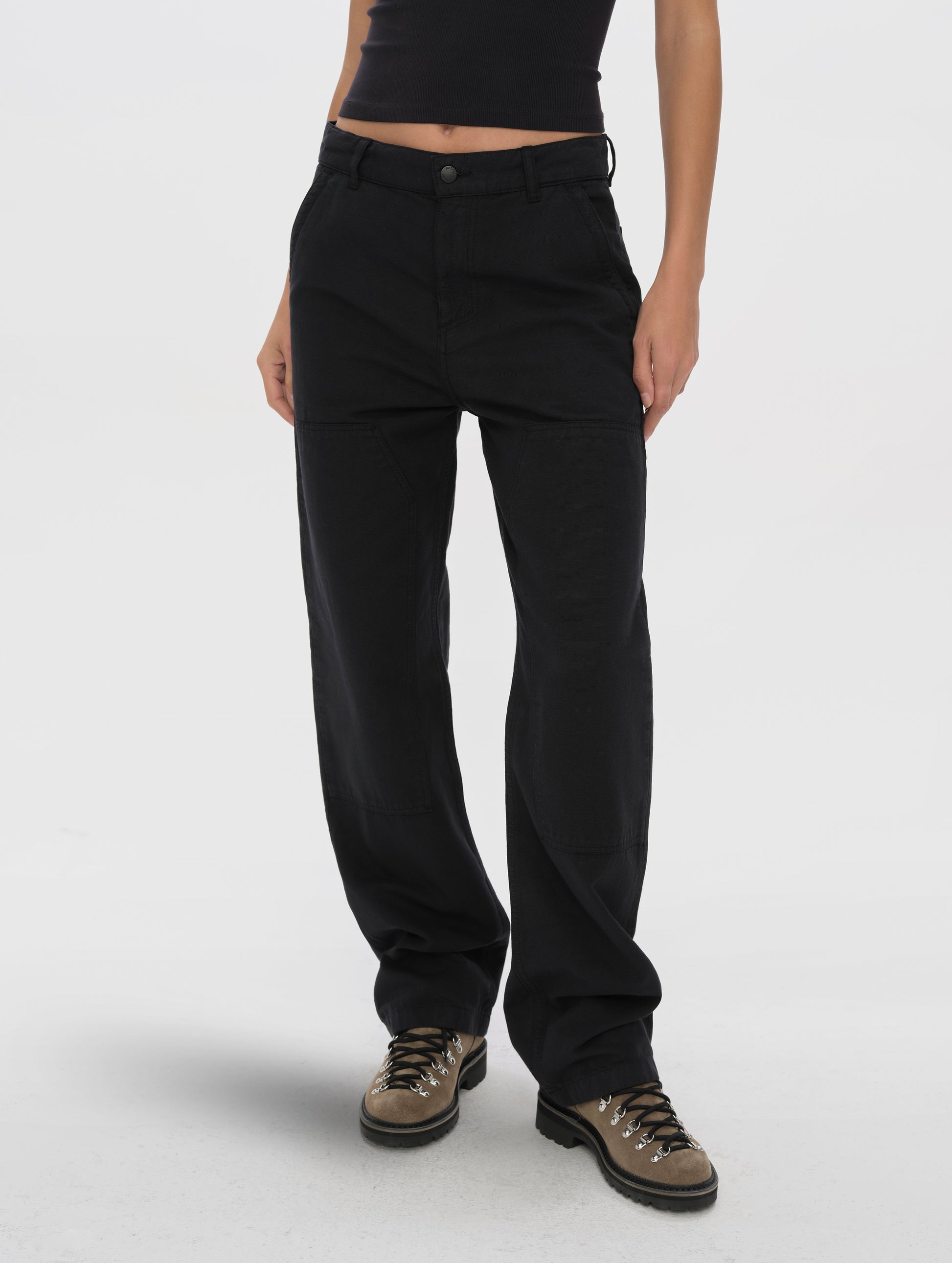Front lower-body view of woman wearing the Natalie Utility Pant in Onyx Black from AETHER Apparel.