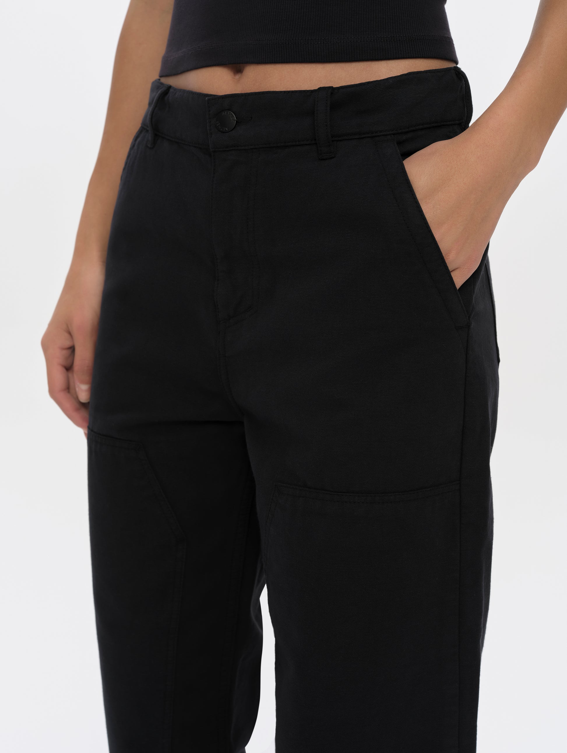 Closeup detailed view of the waistband and hand pockets on the Natalie Utility Pant in Onyx Black from AETHER Apparel.