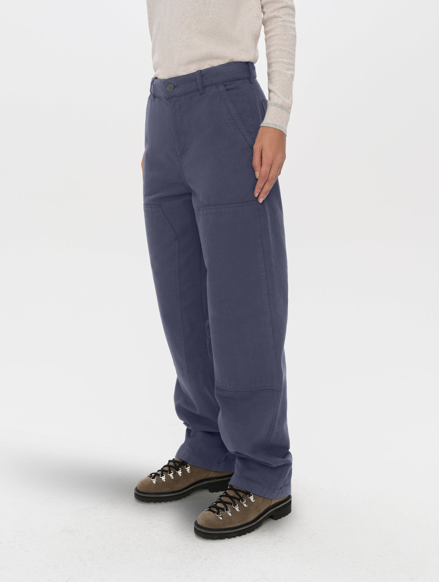 Front angled lower-body view of woman wearing the Natalie Utility Pant in Portal Blue from AETHER Apparel.